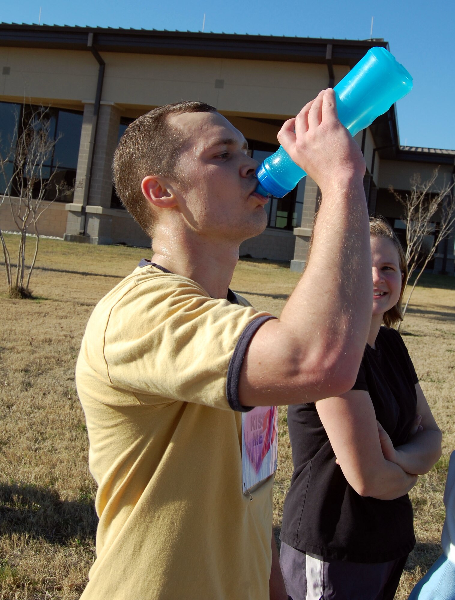 LAUGHLIN AIR FORCE BASE, Texas- Second Lt. Nate Yarolimek,  47th Operations Group, takes a swig of water immediately after completing the Valentine’s Day 5K Fun Run/Walk organized by the fitness center here Jan. 9, 2008. More than 100 members showed up to participate in Laughlin’s Valentine 5K Fun Run/Walk. The event is one of the many ways the Losano Fitness Center keeps Laughlin members fit to fight. (U.S. Air Force photo by Senior Airman Olufemi Owolabi)