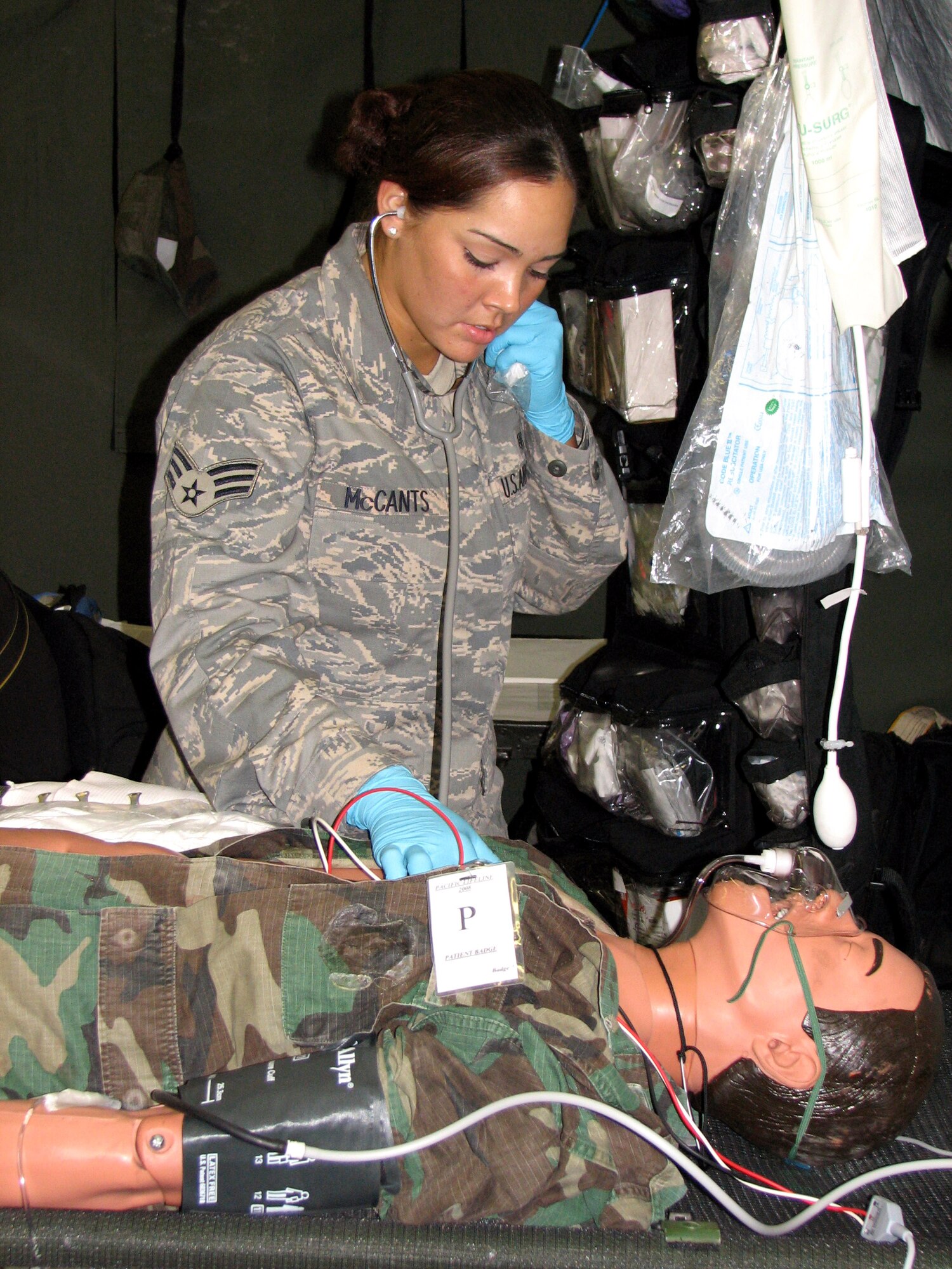 Senior Airman Nicole McCants checks the vital signs of a patient during a mass casualty exercise Feb. 4 at the Kona International Airport at Kona, Hawaii. Airman McCants, a respiratory therapy specialist from the 3rd Medical Group from Elmendorf Air Force Base, Alaska, is one of more than 900 Department of Defense members who participated in Pacific Lifeline, a total force humanitarian assistance and disaster relief exercise that took place from three locations within the Hawaiian Islands through Feb. 9. Led by 13th Air Force, Pacific Lifeline provided an integrated team of Air Force and Army active-duty, Air National Guard and Reserve component forces a training environment to test their abilities to respond to and support humanitarian and natural disaster relief operations. (U.S. Air Force photo/Senior Master Sgt. Charles Ramey) 
