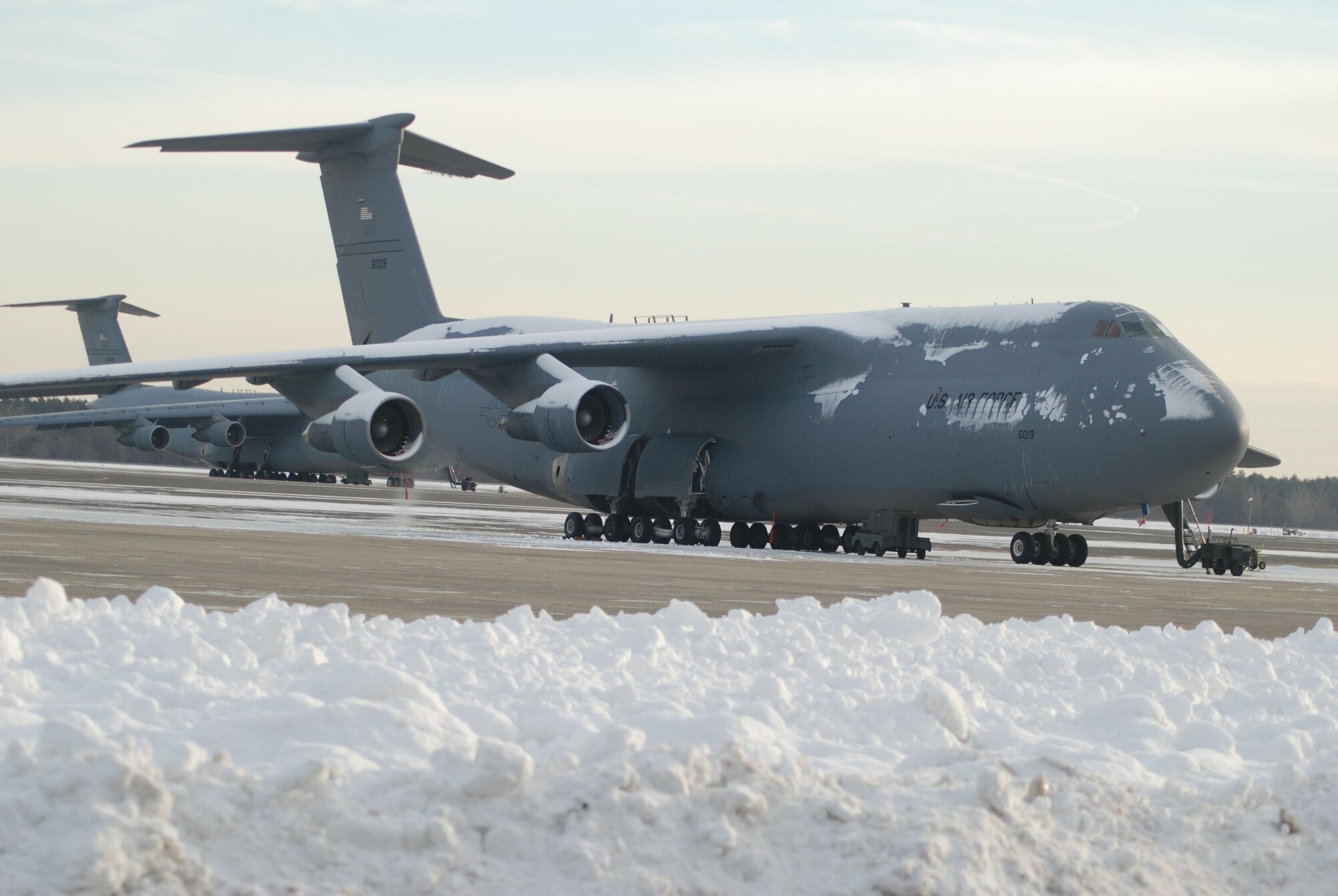 Parked around the New England snow, a 439th Airlift Wing C-5B Galaxy awaits its next mission at Westover. Sixteen of the Air Force's largest aircraft are assigned to the base.
