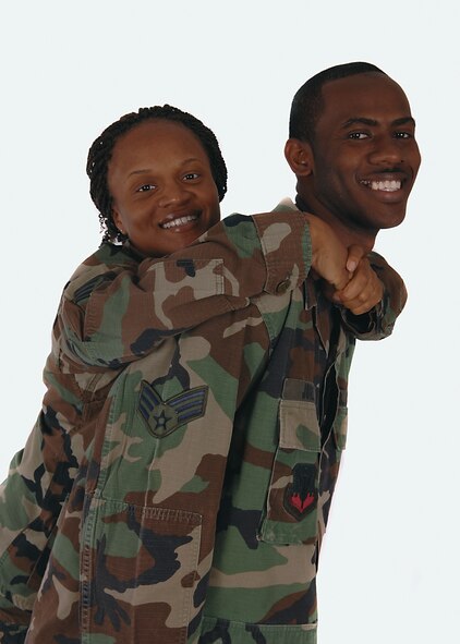MOODY AIR FORCE BASE, Ga. -- Senior Airman Schelli Jones, 23rd Wing photographer, and her husband Senior Airman Merrill Jones, 23rd Civil Engeineering Squadron heating and air conditioning journeyman, pose for picture recently. The couple became engaged on Valentine's Day of 2006 and were married in July of that year.. (U.S. Air Force photo by Airman 1st Class Brittany Barker) 
