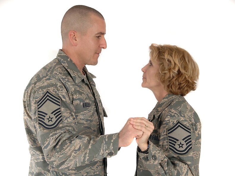 MOODY AIR FORCE BASE, Ga. -- Chief Master Sgt. Thomas Vallely, 347th Operations Support Squadron chief controller, and his wife, Senior Master Sgt. Dianna Vallely, 23rd Medical Operations Squadron superintendent, share a moment here Feb. 7. The Vallelys will be celebrating their 20-year wedding anniversary this year. (U.S. Air Force photo by Airman 1st Class Brittany Barker) 
