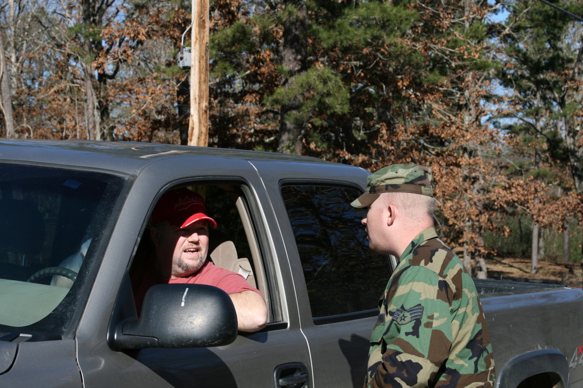 Senior Airman Brandon Lane, an Arkansas Air National Guardsman with the 189th Airlift Wing, staffed an entry-control point on Memory Lane in Clinton, Ark., Feb. 9. The security forces member was one of about 50 Army and Air National Guardsmen in Clinton and Van Buren County to keep looters away and control access to damaged areas after a tornado struck Feb. 5. The EF4 tornado, measured on the Enhanced Fujita scale, had winds of 166-200 mph as it ripped a 123-mile path through North Central Arkansas. (U.S. Air Force Photo by Master Sgt. Bob Oldham)
