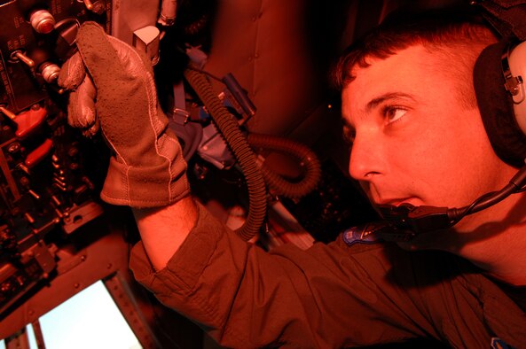 Tech. Sgt. Chad Ellingson, 41st Electronic Combat Squadron Flight Engineer, performs pre-flight checks on a C-130 here, Jan. 31. (U.S. Air Force photo/Airman 1st Class Noah R. Johnson)