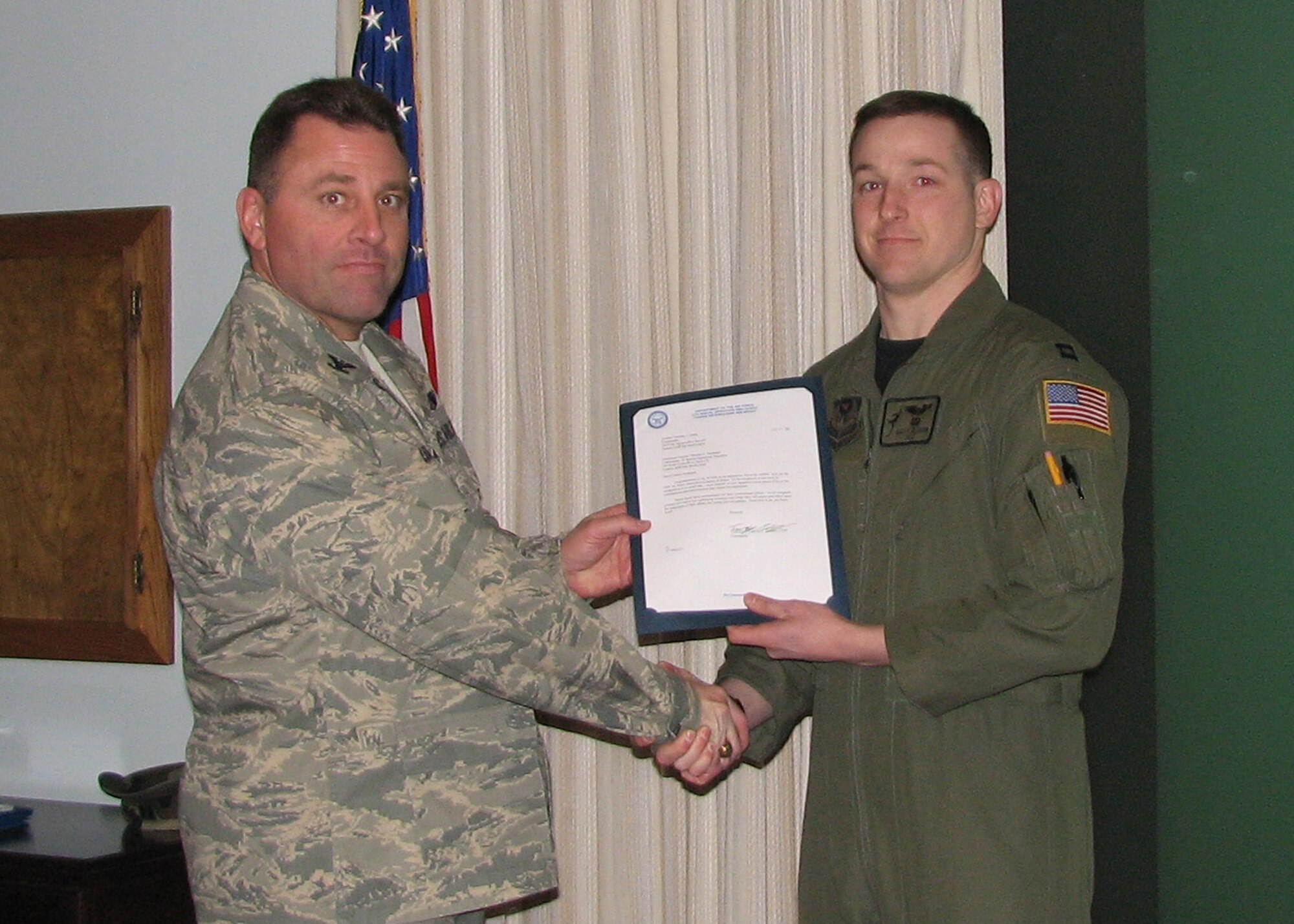 CANNON AIR FORCE BASE, N.M. -- Colonel Timothy Leahy, 27th Special Operations Wing Commander, presents the 2008 Air Force Association's Citation of Honor award to Captain Rusty Allison, 3rd Special Operations Squadron. Capt Allison accepted the award on behalf of the squadron on Feb. 5. (US Air Force photo by Master Sgt. Sgt. Cynthia Crouch).