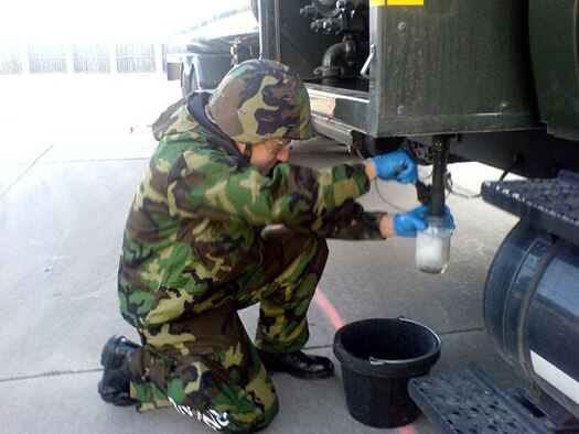 Staff Sgt. Joel Noell from the 507th Mission Support Group Logistics Readiness Squadron’s Petroleum, Oil and Lubricant (POL) section draws a sample from a fuel truck to conduct a visual examination.