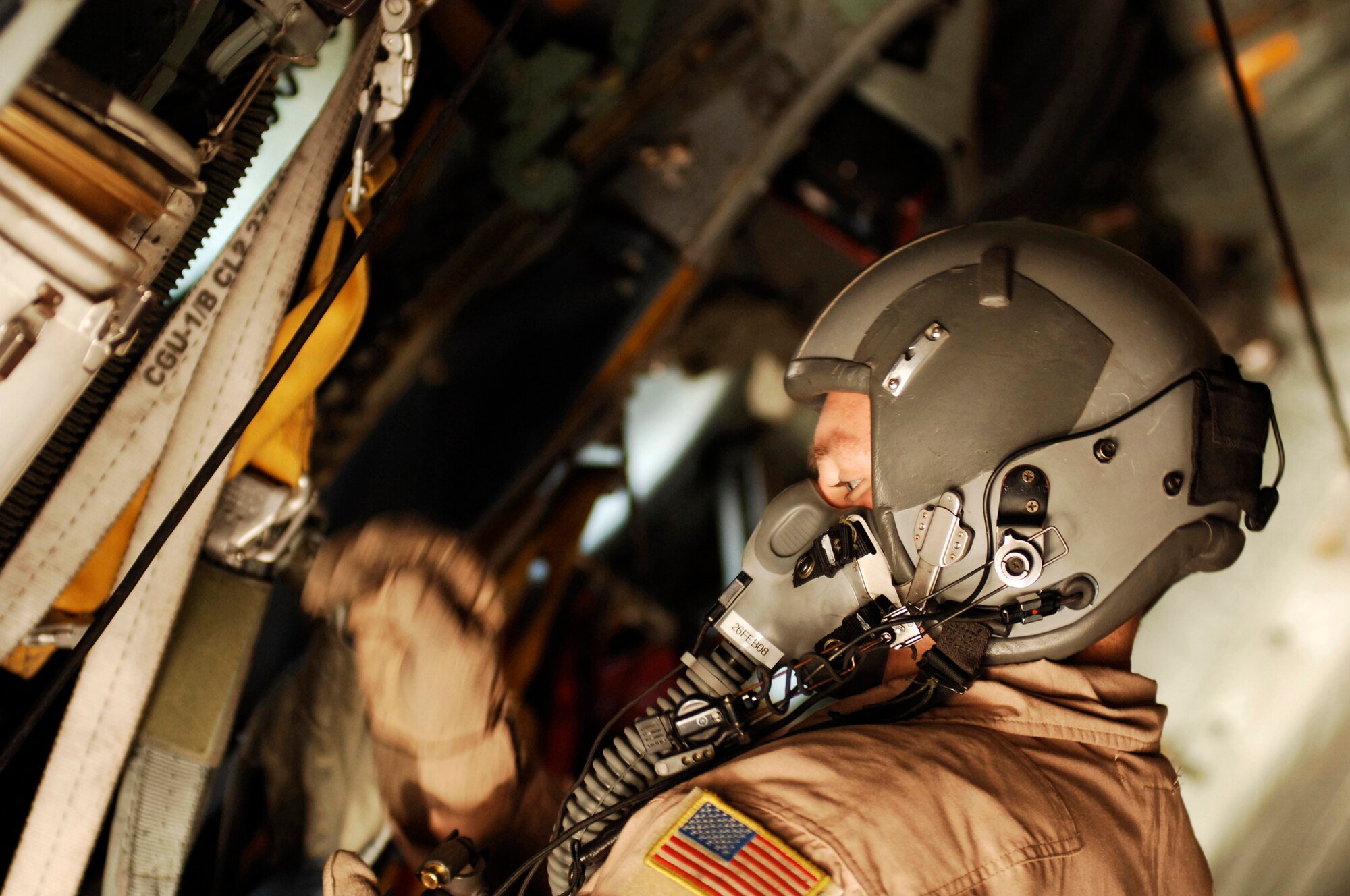 Senior Airman Kenny Harmon does a pre-flight oxygen mask inspection aboard a C-130 Hercules Feb. 4 at a Southwest Asia air base. Airman Harmon is deployed in support of operations Enduring Freedom and Iraqi Freedom and a part of his duties as loadmaster is to ensure the safety of members on board the aircraft while being transported throughout the area of responsibility. He is a C-130 loadmaster deployed with the 737th Expeditionary Airlift Squadron. (U.S. Air Force photo/Staff Sgt. Patrick Dixon)
