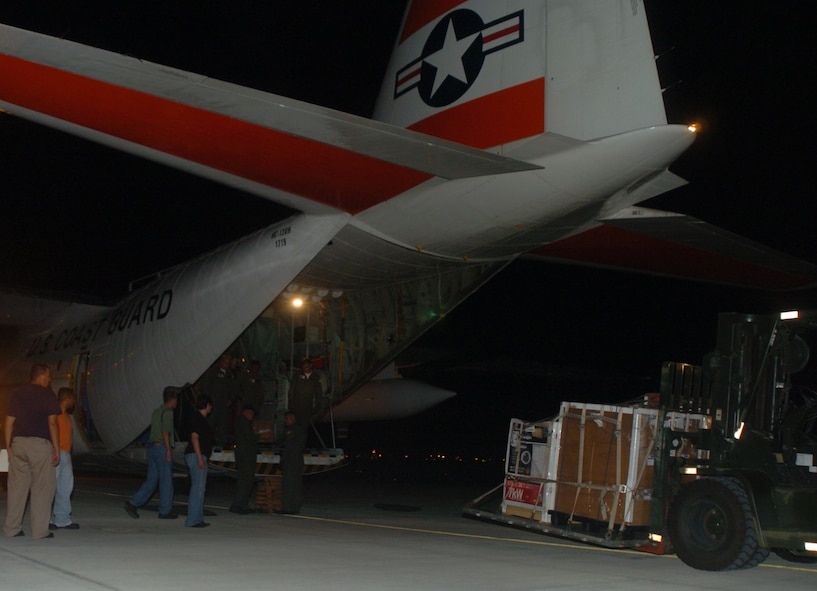 FORWARD OPERATING LOCATION MANTA, Ecuador - A Coast Guard HC-130 landed at Forward Operating Location Manta, Ecuador Thursday, carrying more than one million vitamins and a generator for donation by a non-profit organization to local schools and orphanages in Ecuador.  (U.S. Air Force photo/Capt. Ashley Norris)