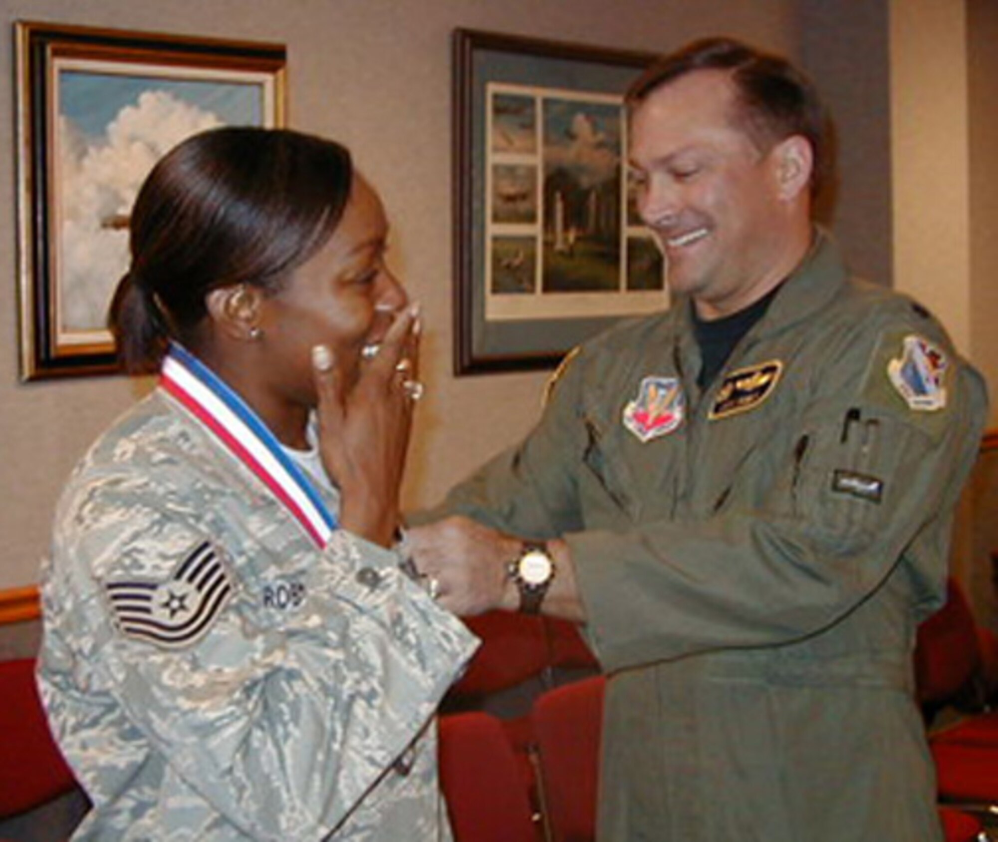 Newly promoted Tech. Sgt. Tanya Robinson, 29th Test Systems Squadron Det. 3, gets her stripes tacked on by Lt. Col. Jack Knight, 29th TSS commander Feb. 5 at Barksdale Air Force Base, La.  Less than a week after returning from a deployment, Sergeant Robinson was attending a commander's call when she was informed of the news.  Her commander, Lt. Col. Tom Silvia, Det. 3 commander, said the promotion was richly deserved.
“Tech. Sgt. Tanya Robinson is the most dedicated NCO I've had the privilege of working with in my 19 years of service," he said.  "She achieved this promotion because her duty performance is simply astounding.  She is the type of NCO our Air Force needs to continue to be the best in the world.” 
U.S. Air Force photo.