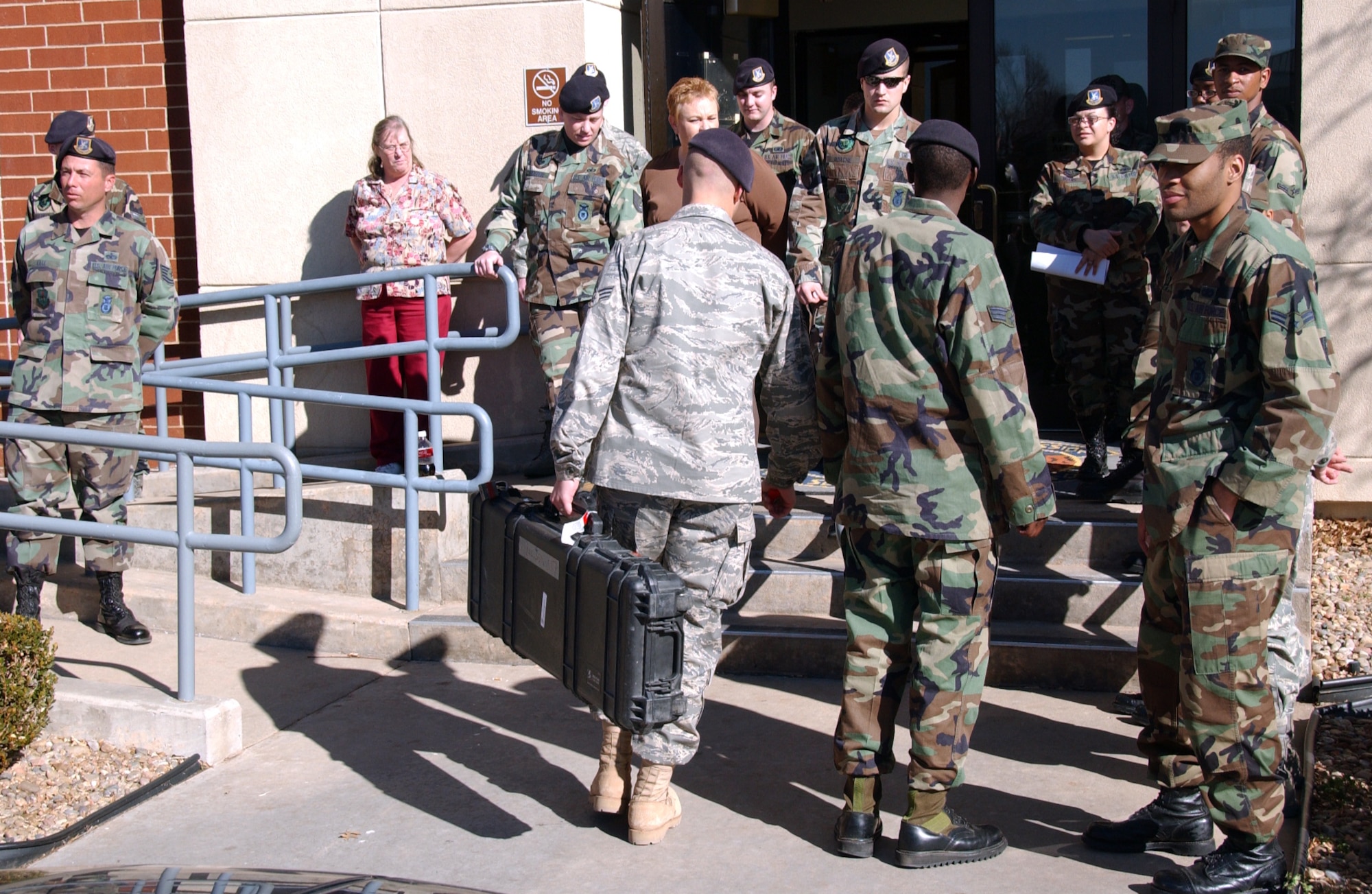 ALTUS AIR FORCE BASE, Okla. – 97th Security Force Squadron members wait to greet Capt. Jason Livingston, 97 SFS, who returned from a deployment to Southwest Asia, Feb. 6. (U.S. Air Force photo/Senior Airman Clinton Atkins)
