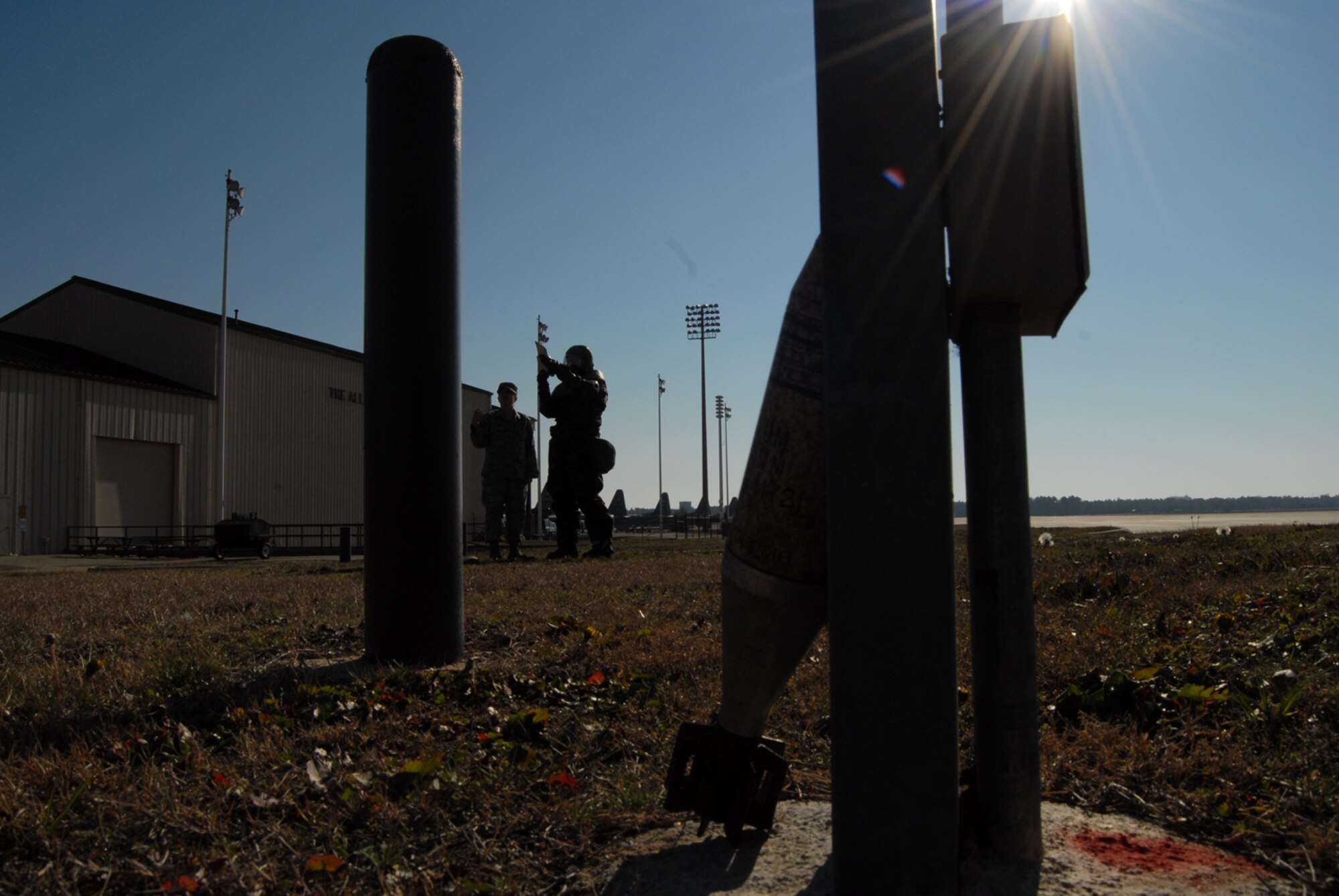 A simulated unexploded ordinance sits on the ground outside the 3rd Aerial Port Squadron building during post-attack reconnaissance sweep training Jan. 8. 