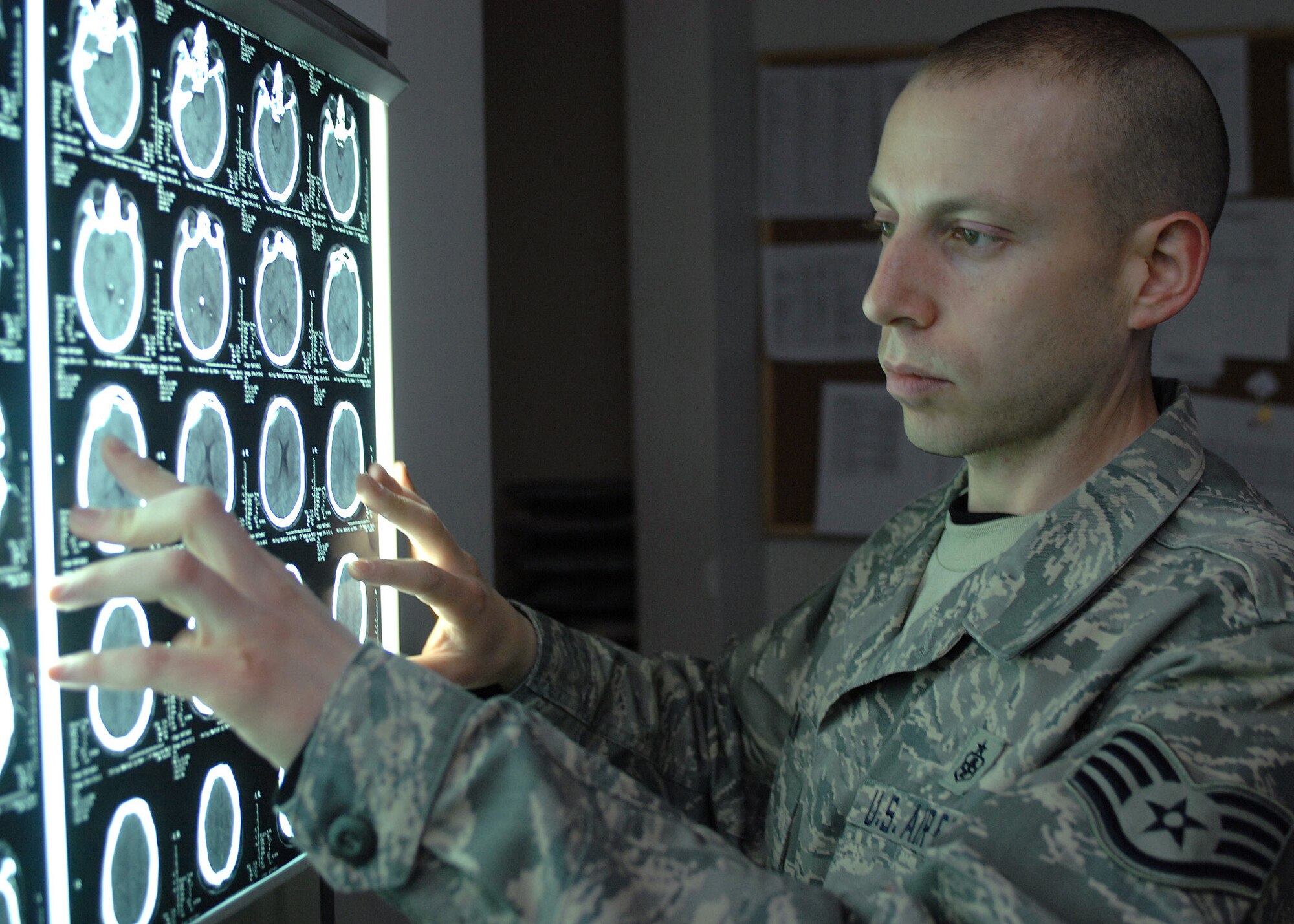BAGRAM AIR BASE, Afghanistan - Staff Sgt. Josh Zilin, NCOIC Diagnostic Imaging Flight, Craig Joint Theater Hospital, hangs film for a radiologist and surgeon review here Jan. 10. Zilin was selected as the Warrior of the Week  for performing more than 6,000 studies for routine and trauma patients in a four-month period. Zilin's home unit is the 10th Medical Operations Squadron at the U.S. Air Force Academy in Colorado Springs, Colo. (U.S. Air Force photo by Master Sgt. Demetrius Lester) 
