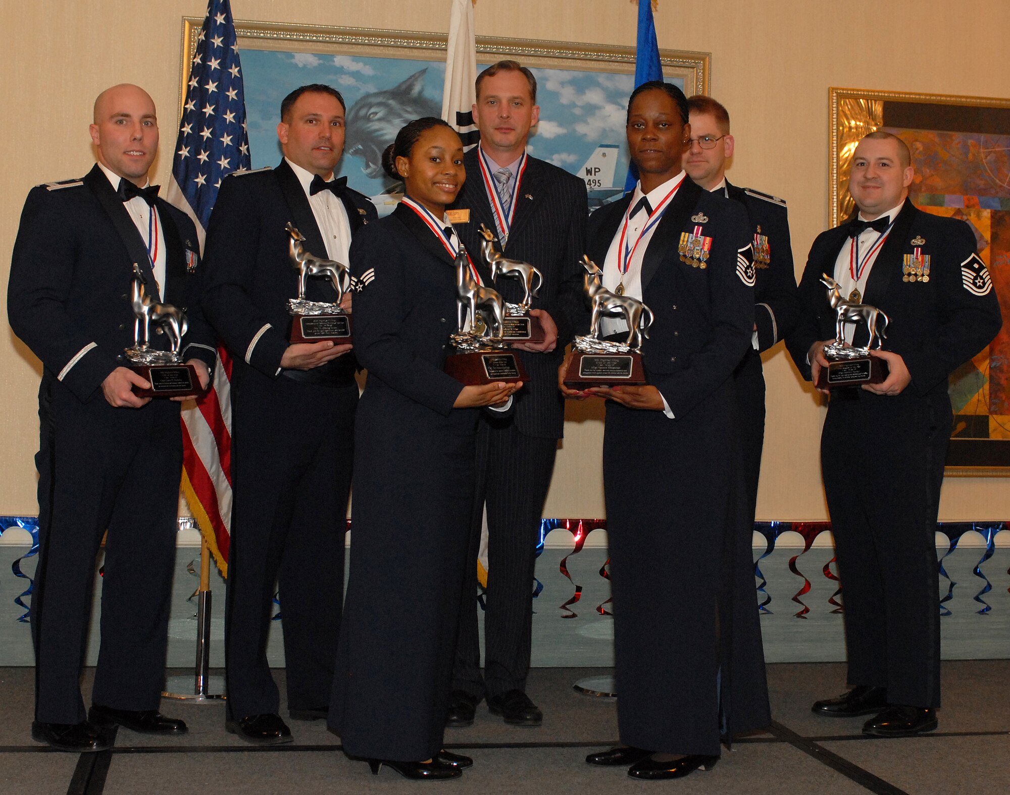 KUNSAN AIR BASE, South Korea -- 8th Fighter Wing Annual Award winners pose for a group photo here Feb 10. The banquet is held annually to recognize all outstanding personnel for their commitment and hard work. (U.S. Air Force photo/Senior Airman Giang Nguyen)