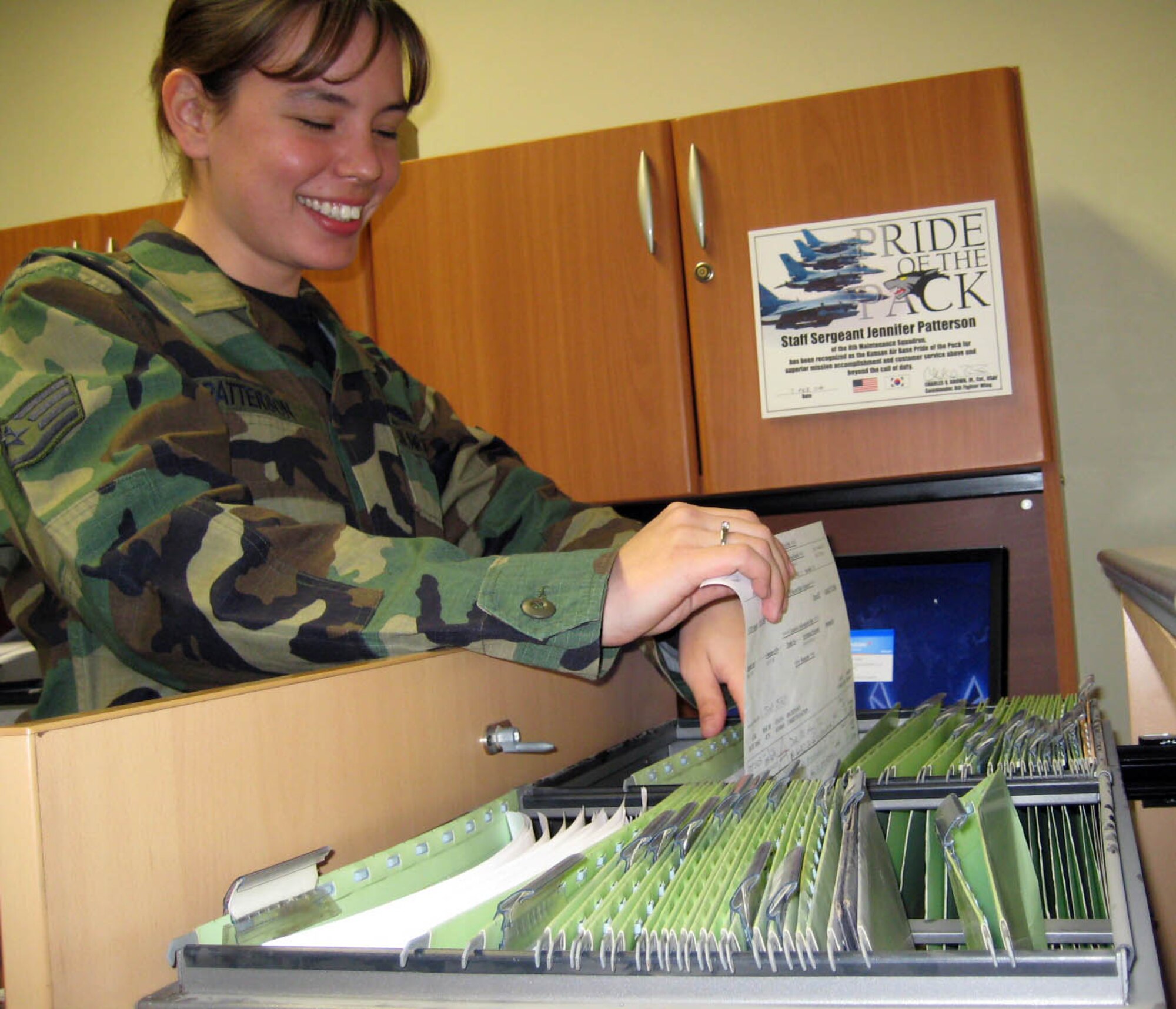 KUNSAN AIR BASE, South Korea --  Staff Sgt. Jennifer Patterson, 8th Maintenance Squadron precision guided munitions crew chief, files paperwork here Feb. 7. Sergeant Patterson was selected as the 8th Fighter Wing's Pride of the Pack for the week of Feb. 4. (U.S. Air Force photo/Staff Sgt. Keith Long)