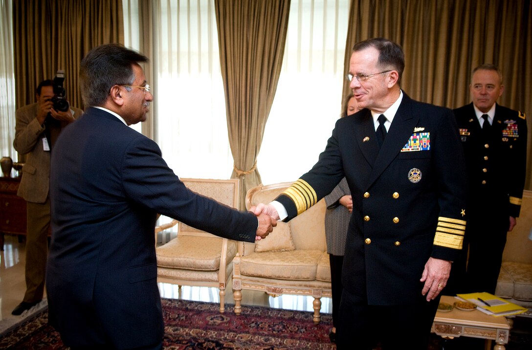 Pakistani President Gen. Pervez Musharraf, left, greets Chairman of the Joint Chiefs of Staff Navy Adm. Michael G. Mullen in Islamabad, Pakistan, Feb. 9, 2008. 