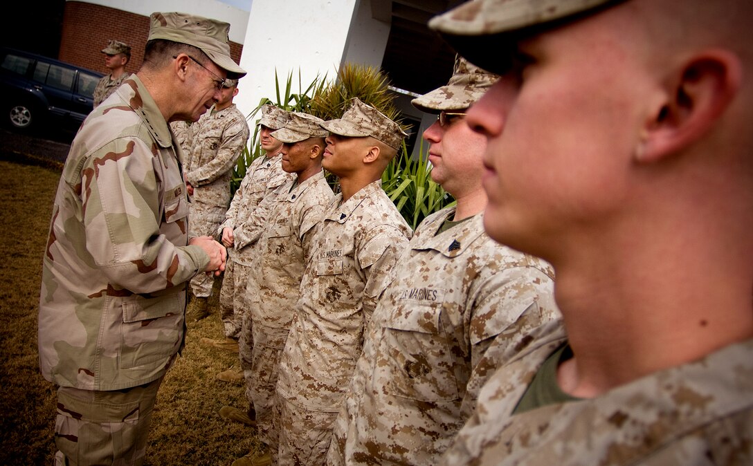 U.S. Navy Adm. Michael G. Mullen, chairman of the Joint Chiefs of Staff, greets U.S. Marines assigned to the U.S. embassy in Islamabad, Pakistan, Feb. 8, 2008.   