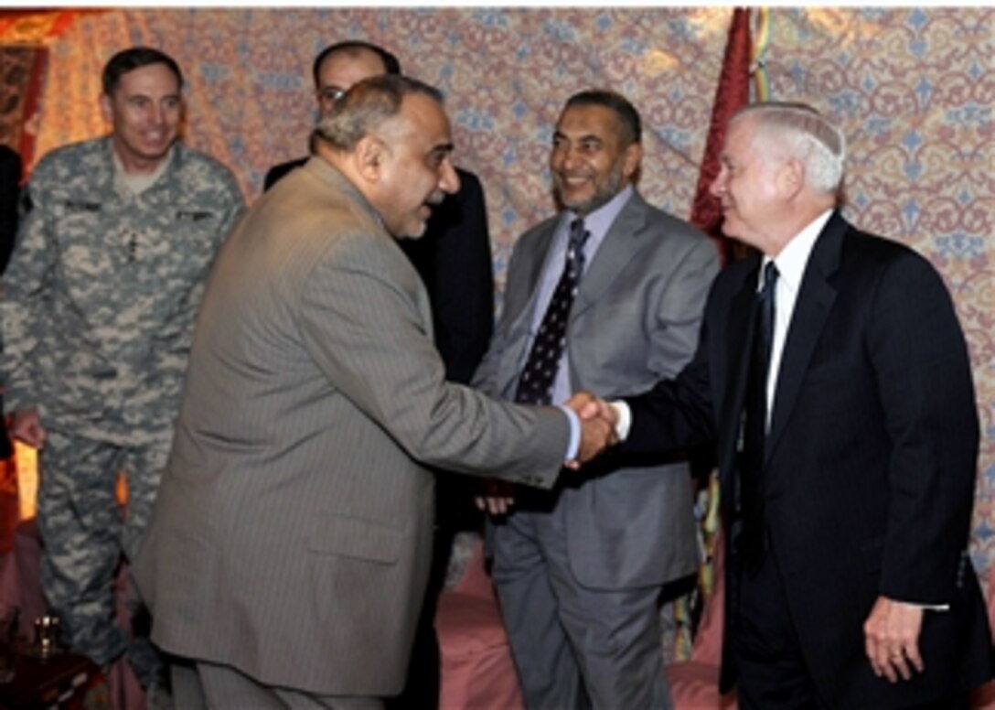 Iraqi Vice President Adil Abd Al-Mahdi, left, greets U.S. Defense Secretary Robert M. Gates upon his arrival for an unannounced visit to Iraq after Gates left the 44th Munich Conference on Security Policy, Feb. 10, 2008.  