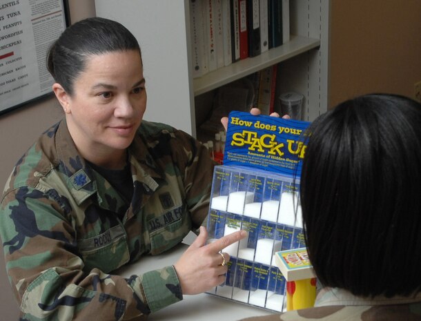 NELLIS AIR FORCE BASE, Nev.—Lt. Col. Danelle Roddy, 99th Medical Group dietitian, discusses the sugar levels found in various energy drinks with a patient at the Mike O’ Callaghan Federal Hospital here Feb.11. Lt. Col. Roddy was selected as the U.S Air Force outstanding field grade dietitian of the year. (U.S. Air Force photo by Senior Airman Nadine Y. Barclay)