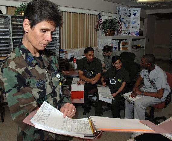 NELLIS AIR FORCE BASE, Nev.—Capt. Jill Koeven, 99th Inpatient Squadron nurse supervisor, checks over a patient's chart before beginning her rounds at the Mike O’ Callaghan Federal Hospital here Feb. 8. Capt. Koeven was selected as the 2007 U.S. Air Force company grade nurse of the year. (U.S. Air Force photo by Senior Airman Nadine Y. Barclay)