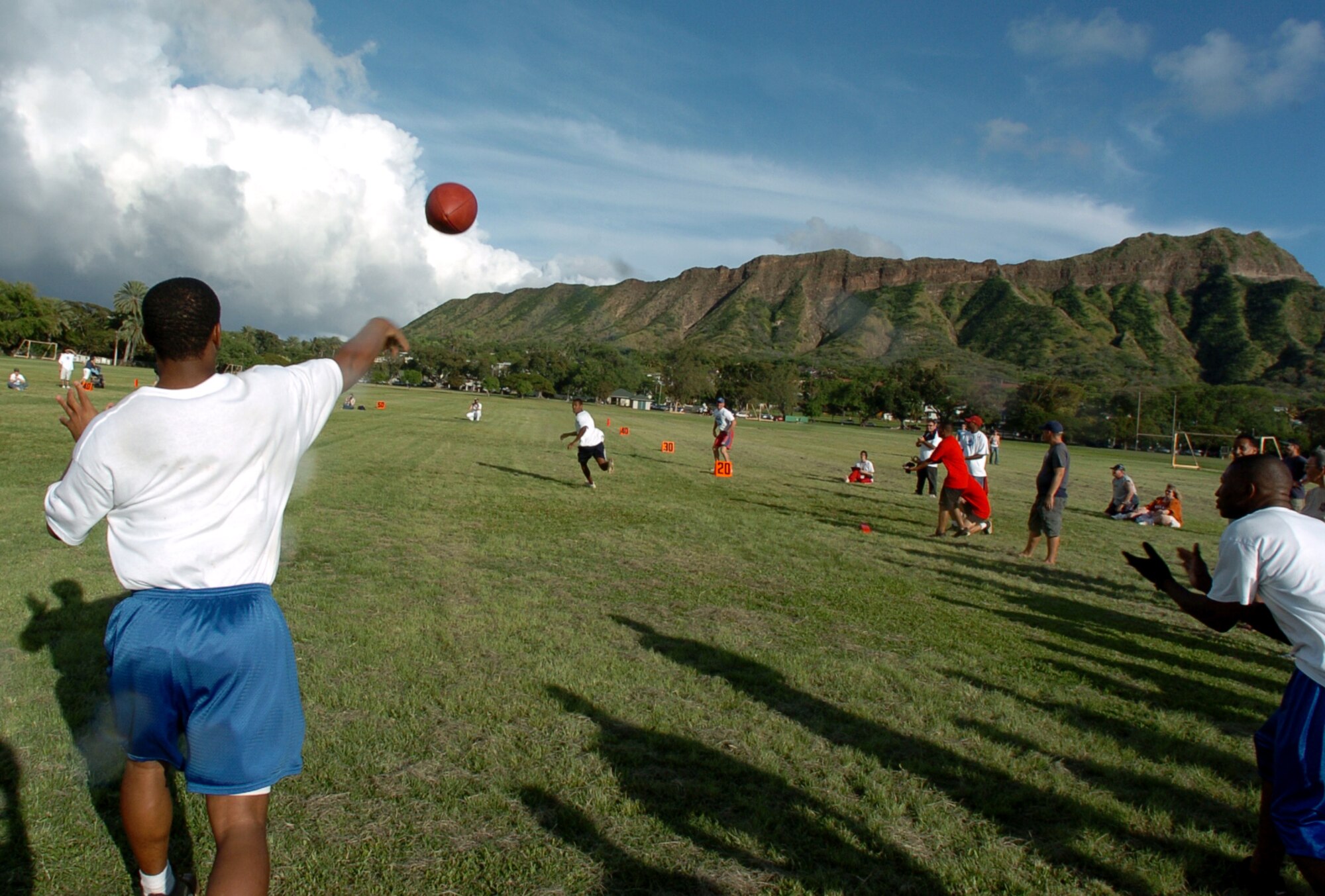 Calvin Kirton launches one of his twelve perfect spirals, leading the Team Hickam rostered Air Force team to a challenge record 30 points and the NFL Military Challenge competition Friday at Kapiolani Park, Oahu HI.