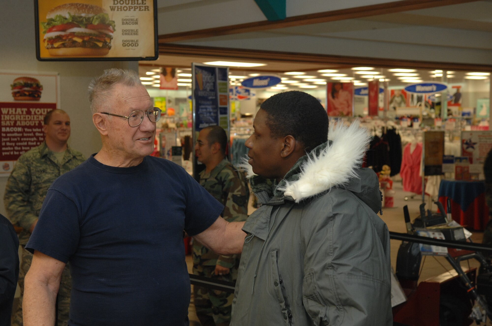 Retired Air Force Master Sgt. John Polonic, has a conversation with an Airman, Feb. 8,  in the base exchange at Ellsworth. Sergeant Polonic bought lunch for 105   service members in appreciation for their hard work and dedication to our country.  (U.S. Air Force photo/ Airman 1st Class Adam Grant)
  