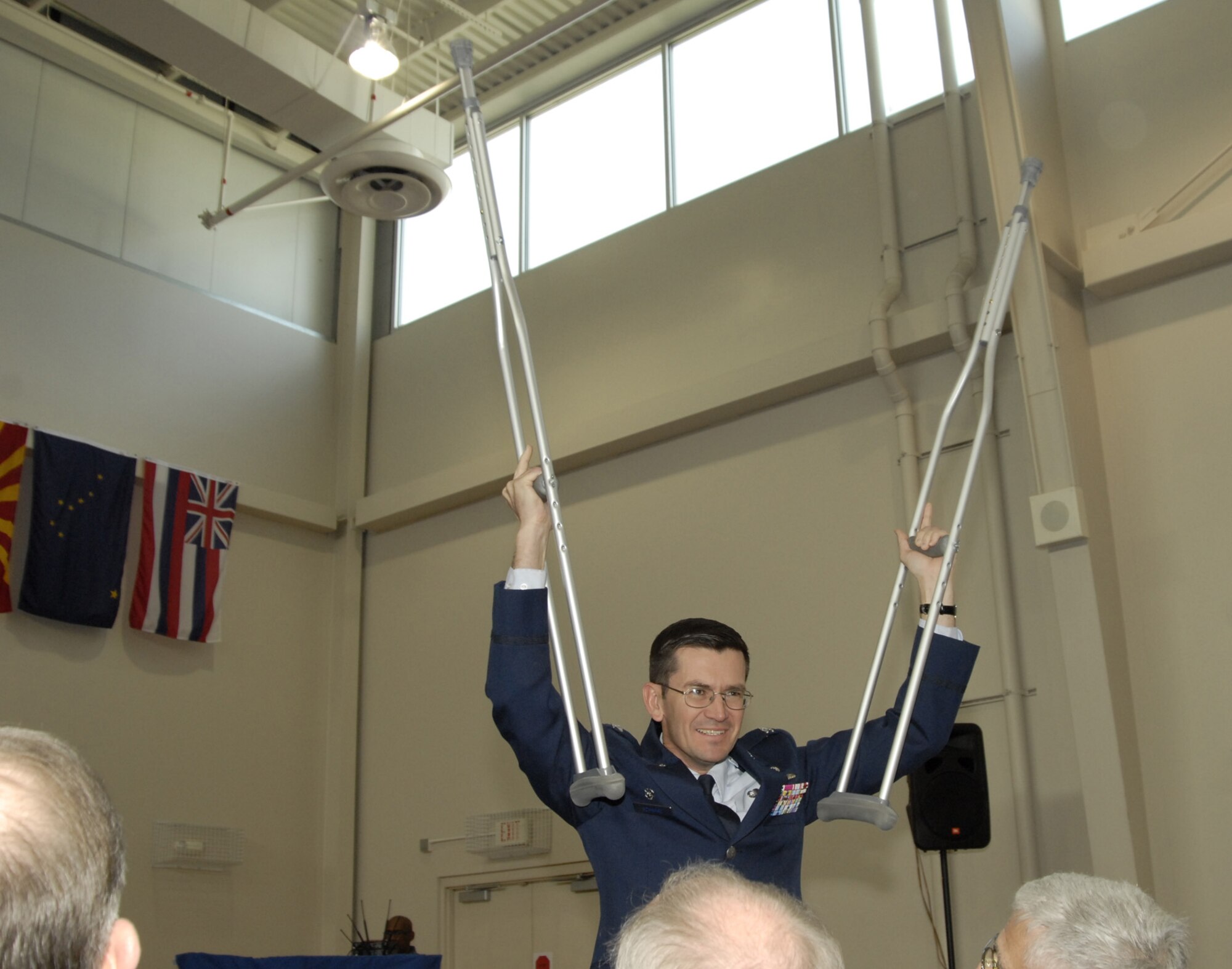 Col. Joseph Schwarz, 61st Air Base Wing commander, leads the cheer for the 61st ABW during the SMC Quarterly Awards, Jan. 31. (Photo by Joe Juarez)