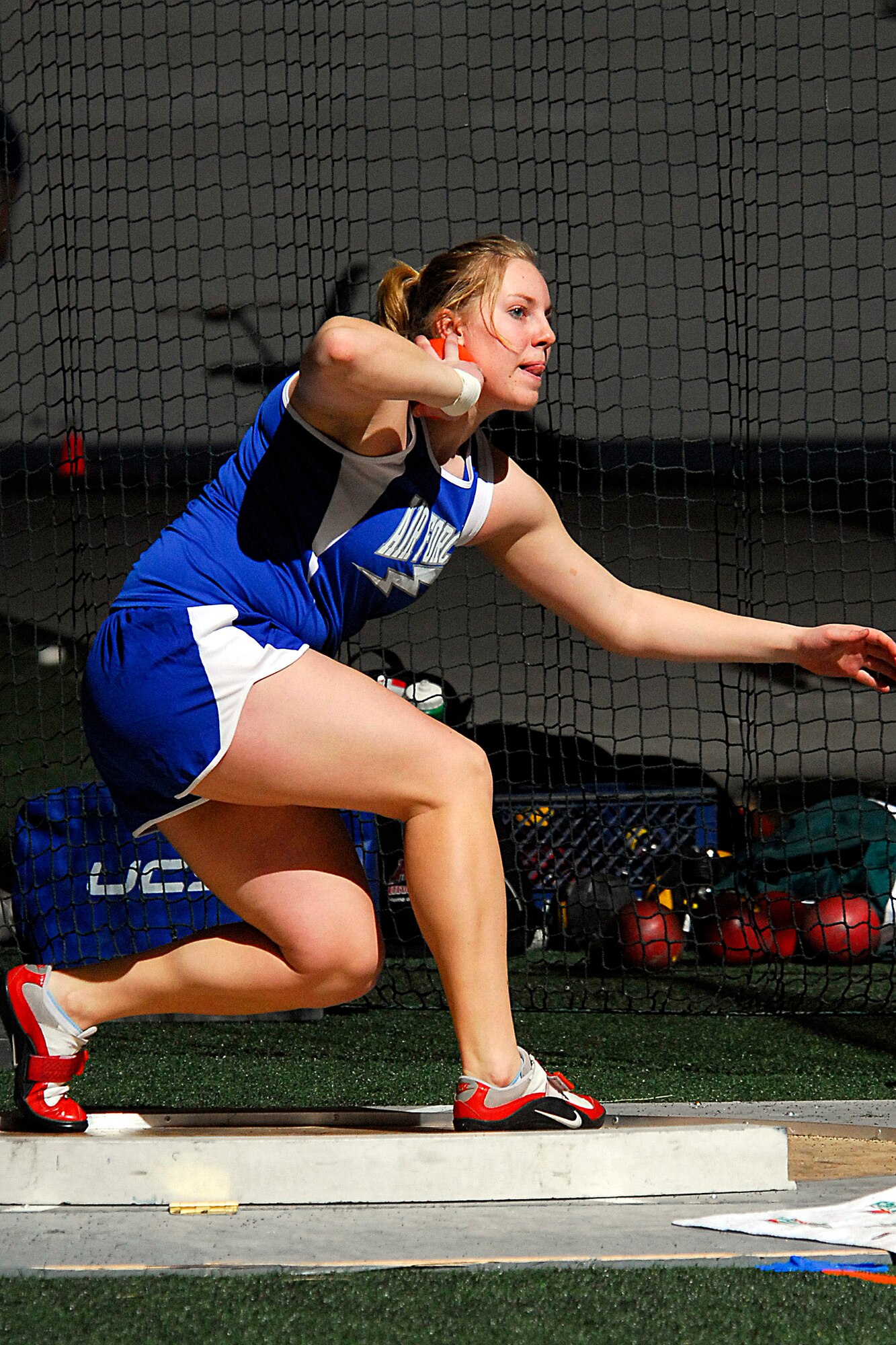 Sophomore Sara Neubauer competes in the shot put, finishing in second place with a throw of 48' 8". The Falcons hosted the Don Barrett-Air Force Open on Feb. 9. Competing at the Academy's Cadet Field House, the Falcons collected 26 top-10 finishes during the non-team scoring meet.  (U.S. Air Force photo/Dave Ahlschwede)