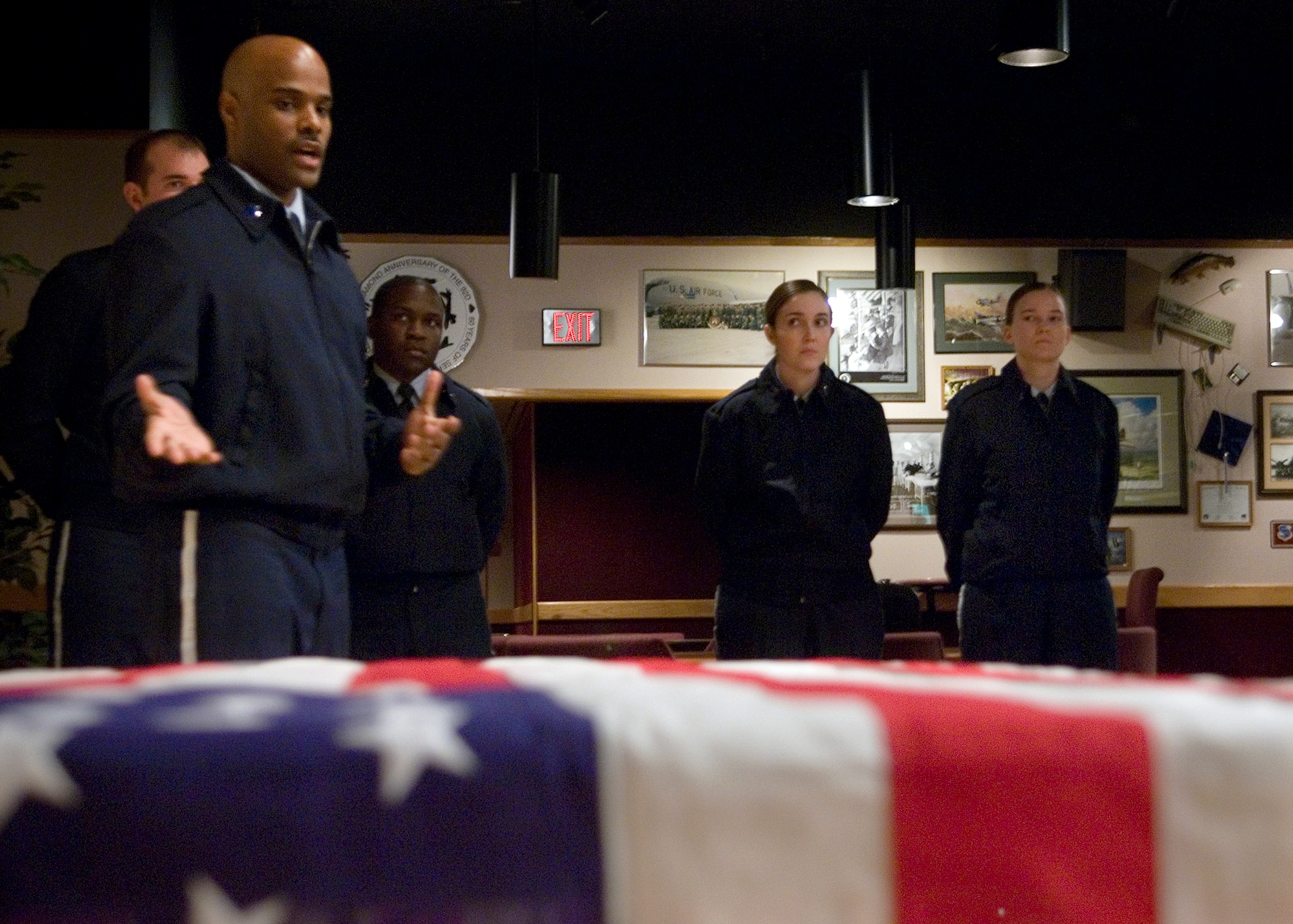 FAIRCHILD AIR FORCE BASE, Wash. – Tech. Sgt. Vidal Hill, 92nd Medical Operations Squadron, demonstrates proper flag-folding techniques to 92nd Mission Support Group officers Feb. 8. Team Fairchild honor guard members trained the officers proper ceremonial flag folding procedures in order to aid in future honor guard requirements. (U.S. Air Force photo / Airman 1st Class Joshua Chapman)