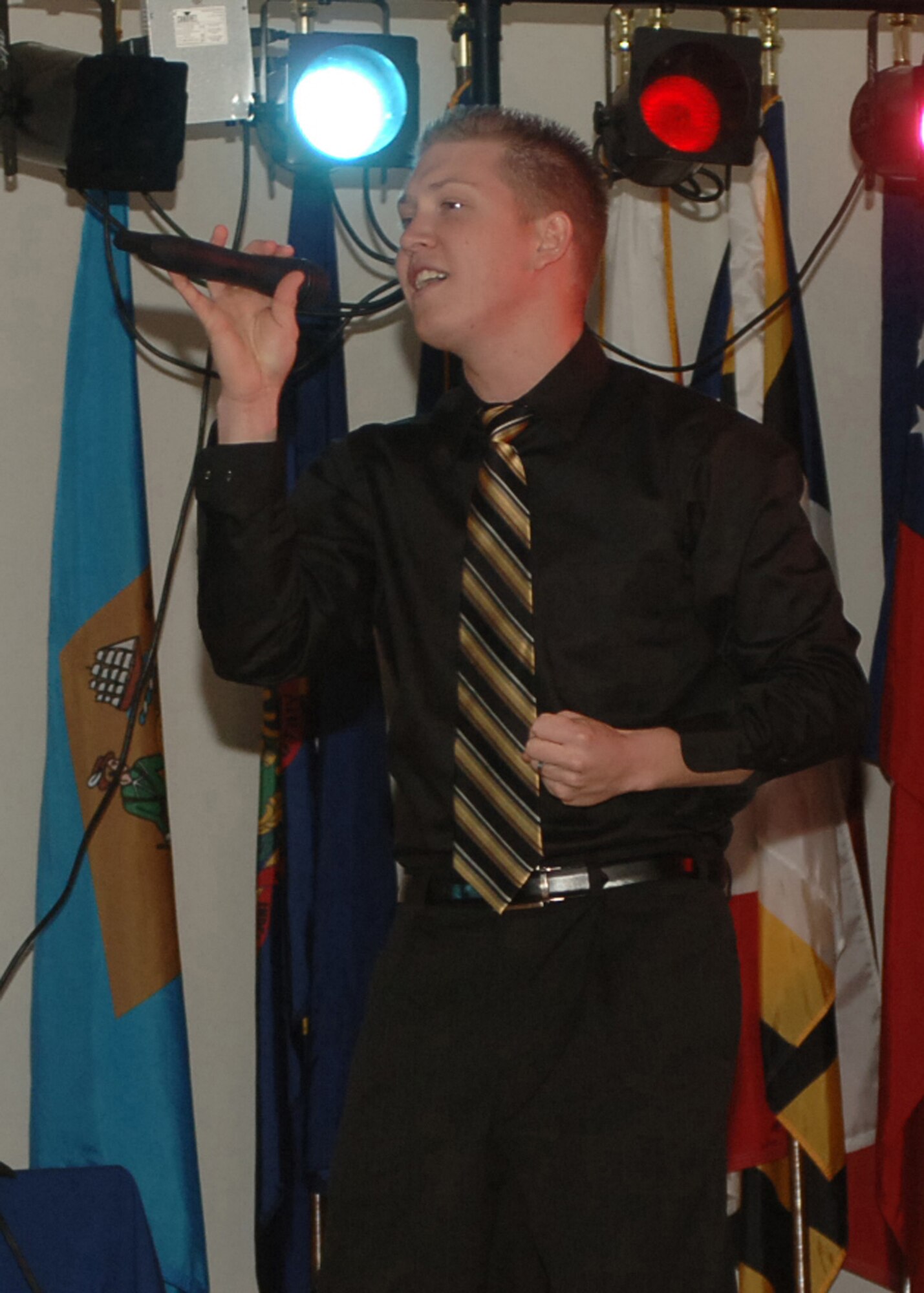 DYESS AIR FORCE BASE, Texas--Senior Airman Bryce Zabric, 7th Aircraft Maintenance Squadron, delights the audience as he sings, I Swear, during the Dyess Idol Competition Feb. 9. Airman Zabric was also a member of Tops In Blue in 2007. (U.S Air Force photo by Airman 1st Class Felicia Juenke)