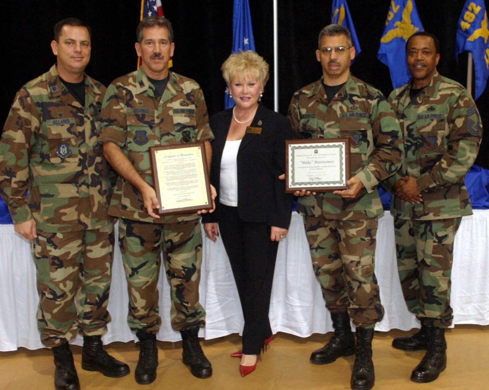 City of Homestead Coucilwoman Judy Waldman presents plaques to the senior leadership of the 482nd Maintenance Group after the second annual 482nd Maintenance Group Awards Ceremony on Feb. 10. Hundreds of people attended the ceremony that featured the appointment dedicated crew chiefs, announced the maintenance professionals of the year awards, and recognition of all maintainers and support personnel contributing to keeping the F-16 at top performance. (U.S. Air Force photo/Tech. Sgt. Paul Dean)
