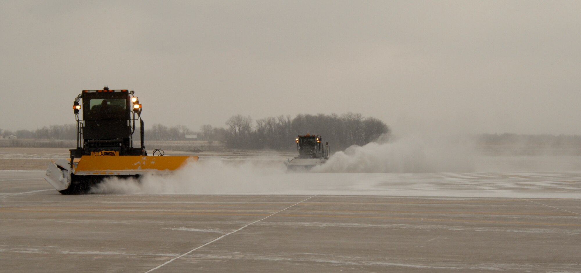 WHITEMAN AIR FORCE BASE, Mo. --- The 509th Civil Engineer Squadron clears the flight line Feb. 12. The 509th CES snow and ice removal team was recently named the best in the Air Force for the year of 2007. (U.S. Air Force photo/Senior Airman Stephanie Clark)