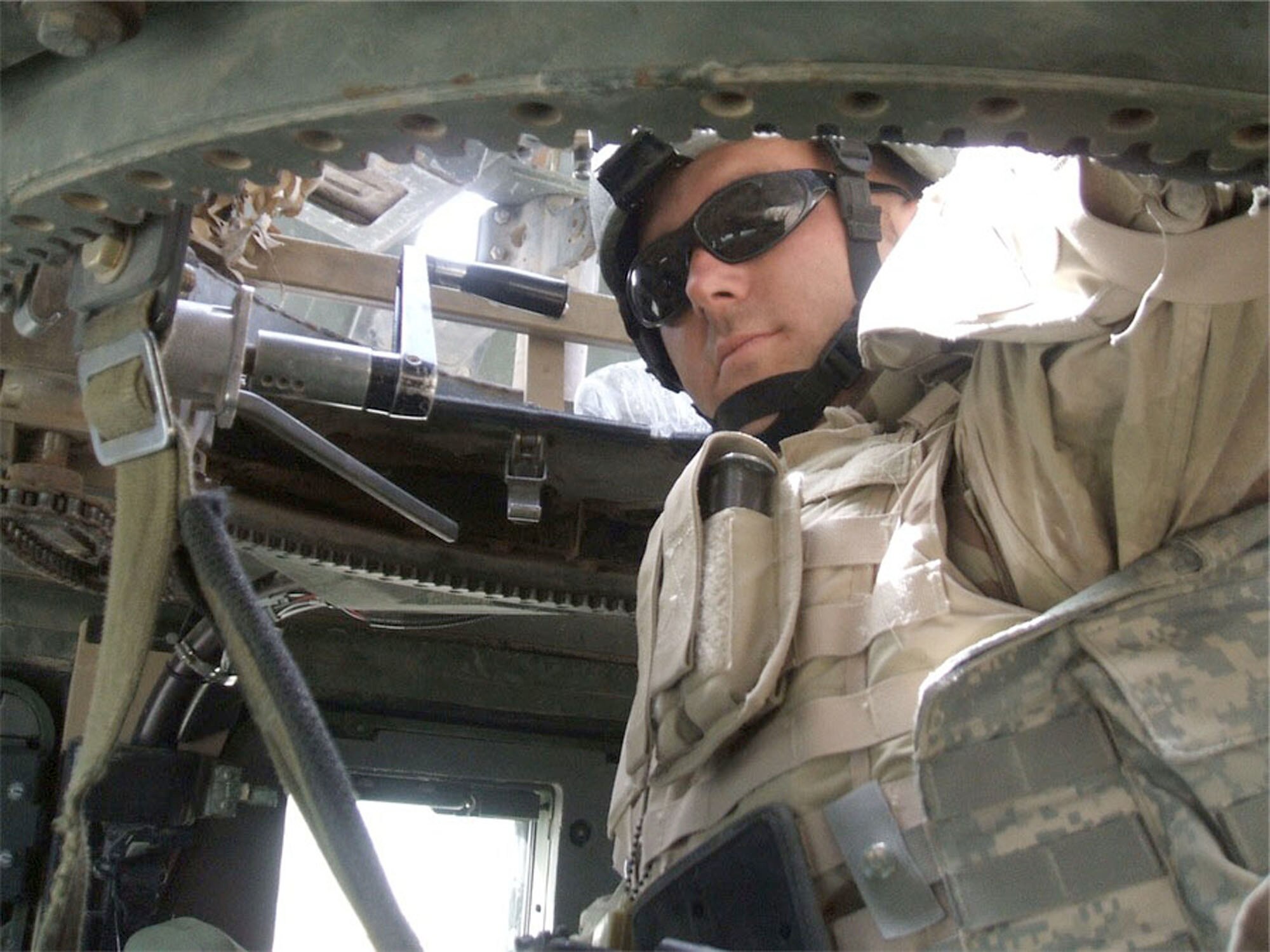 Senior Airman Jonathan Higgins, 732nd Expeditionary Security Forces Squadron, sits in his HUMVEE prior to a mission in downtown Baghdad. The 341st Security Forces Squadron member volunteered for a 365-day deployment to support Operation Iraqi Freedom and in April 2007, an IED exploded near his HUMVEE and immediately ignited the vehicle into flames, incapacitating the team’s interpreter. Airman Higgins climbed out of the turret he was manning and grabbed his M-9 barretta in anticipation of an ambush, ignoring his wounds which included shrapnel to his right calf and second degree burns. He received a Purple Heart and an Air Force Combat Action Medal Feb. 8. (U.S. Air Force photo/Staff Sgt. Ryan Gaulty)