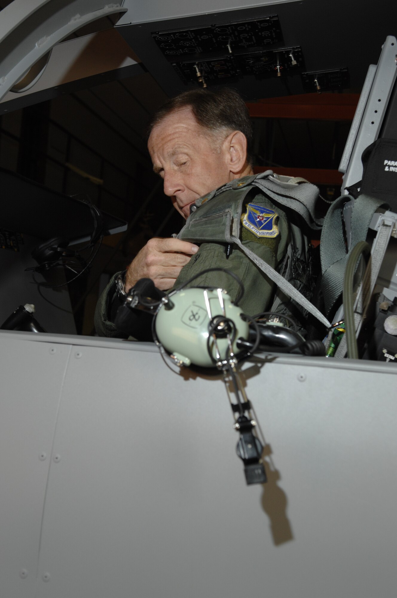 Lt. Gen. Norman Seip, 12th Air Force commander, practices ground egress procedures while inside the B-1 egress trainer at Ellsworth Feb. 7. During his visit, General Seip presented the Airman’s Medal to a 28th Logistics Readiness Squadron Airman for non-combat related actions while deployed to Liberia. (US Air Force photo/ Senior Airman Angela Ruiz)

