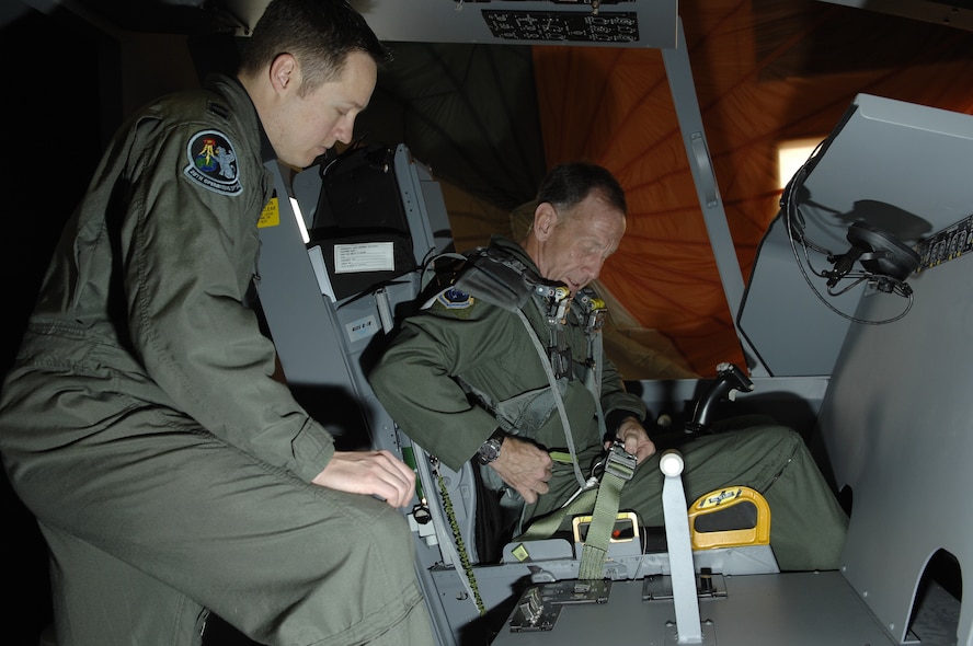 Capt. Heath Miller, 28th Operations Support Squadron wing life support officer, reviews ground egress procedures with Lt. Gen. Norman Seip, 12th Air Force commander, while inside the B-1 egress trainer Feb. 7. While visiting Ellsworth, General Seip presented the Airman’s Medal to a 28th Logistics Readiness Squadron Airman for heroic non-combat related actions while deployed to Liberia. (US Air Force photo/ Senior Airman Angela Ruiz)
