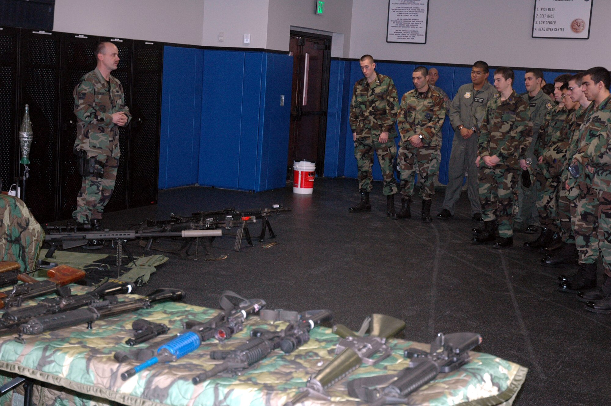 Tech. Sgt. Charles Glunt, from the U.S. Air Force Expeditionary Center's armory, talks to ROTC cadets from the Rennsselear Polytechnic Institute from New York about the vast array of weapons used for student training during the cadet's tour of the Center Feb. 8, 2008, on Fort Dix, N.J.  More than 25 cadets and staff toured the USAF EC to learn more about the school's expeditionary and mobility forces training for the Air Force.  (U.S. Air Force Photo/Tech. Sgt. Scott T. Sturkol)