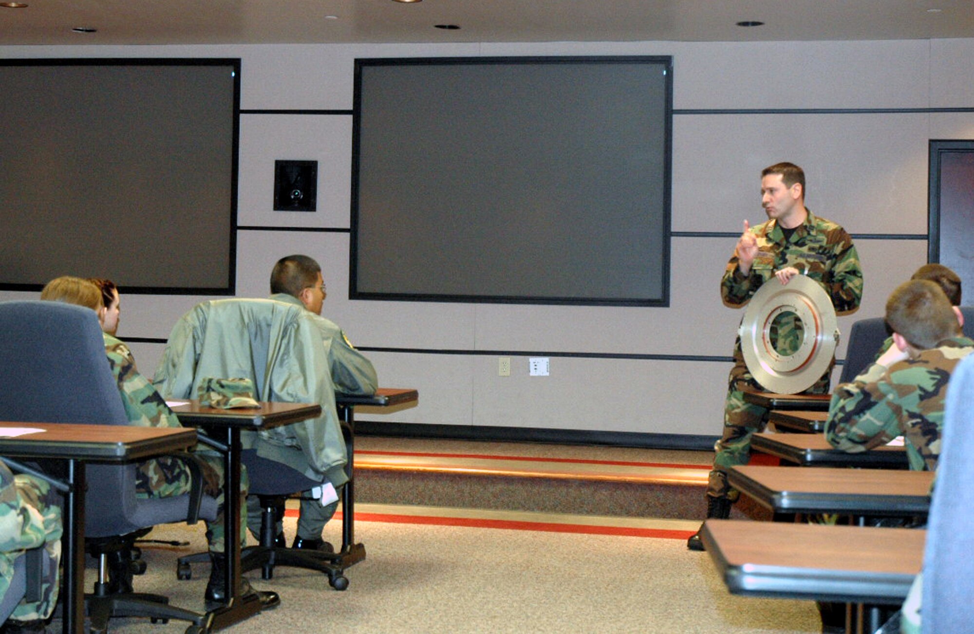 Capt. John Yerger, from the U.S. Air Force Expeditionary Center' Concepts Demonstration Program, talks to ROTC cadets from the Rennsselear Polytechnic Institute from New York during the cadet's tour of the Center Feb. 8, 2008, on Fort Dix, N.J.  More than 25 cadets and staff toured the USAF EC to learn more about the school's expeditionary and mobility forces training for the Air Force.  (U.S. Air Force Photo/Tech./ Sgt. Scott T. Sturkol)