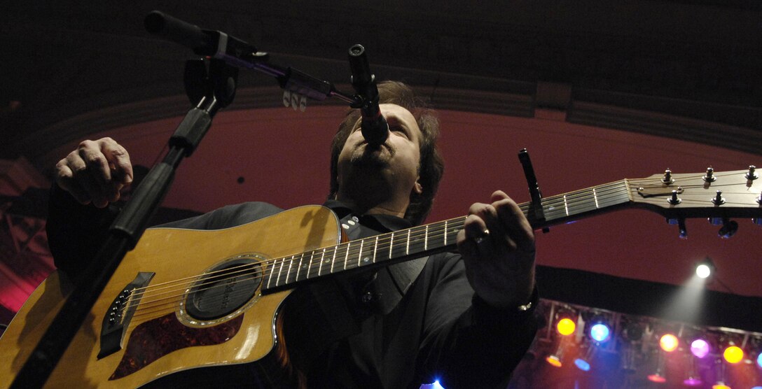 Larry Stewart, Restless Heart band member, performs with the U.S. Air Force Band at the Daughters of the American Revolution Constitution Hall in Washington Feb. 10. The Band performed with the country music legend Restless Heart as part of its 2008 Guest Artist Series, which runs through March 2. (U.S Air Force photo by Airman 1st Class Alexandre Montes)