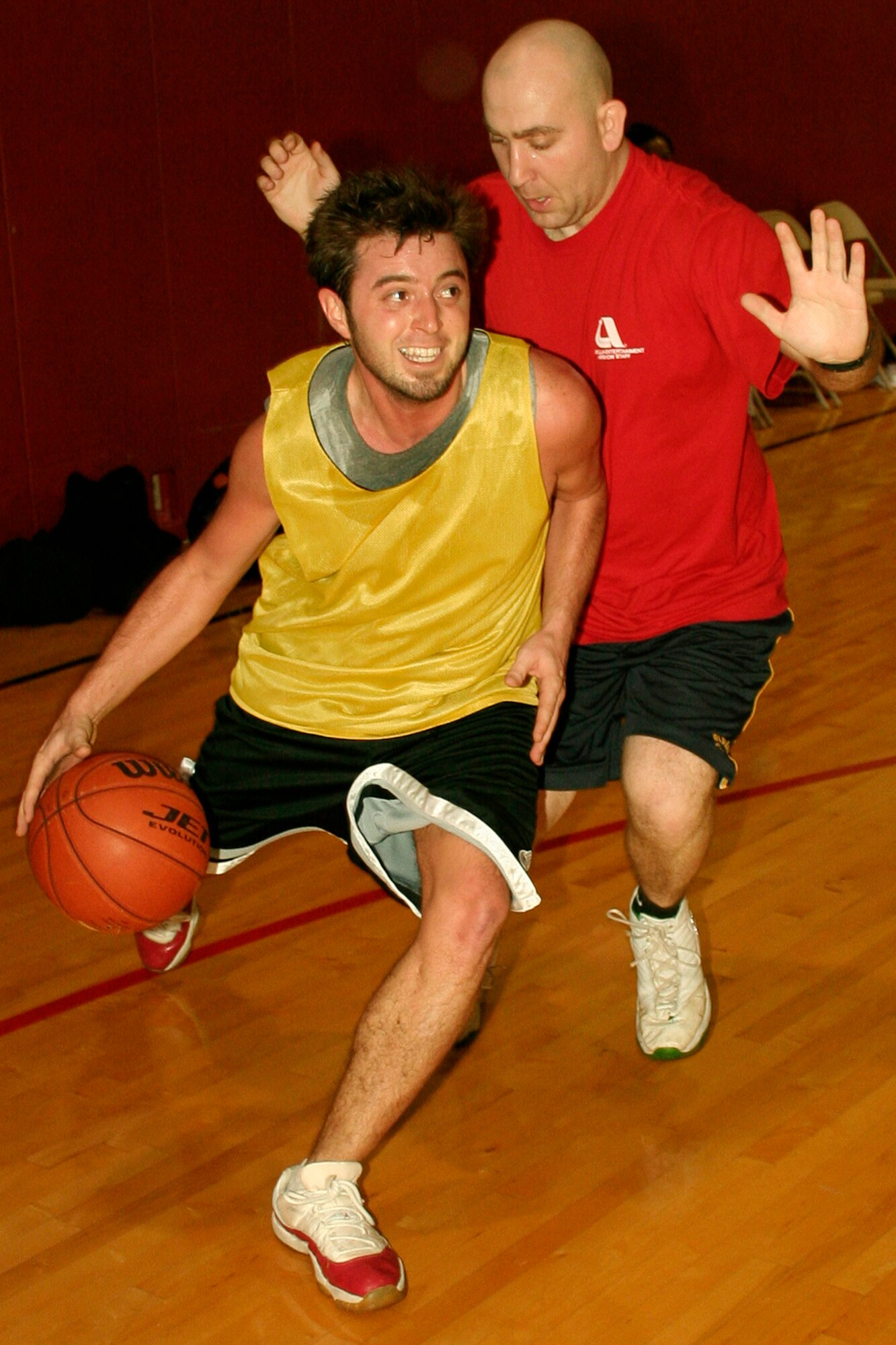 GRISSOM AIR RESERVE BASE, Ind., --  Brian Wright, 434th Logistics Readiness Squadron, makes his move toward the basket against Tony Ayres, Department of Defense Police, during second round action of Grissom's annual basketball tournament.  The DOD police advanced with a 51-33 win over the Loggies. (U.S. Air Force Photo/Tech. Sgt. Patrick M. Kuminecz)

