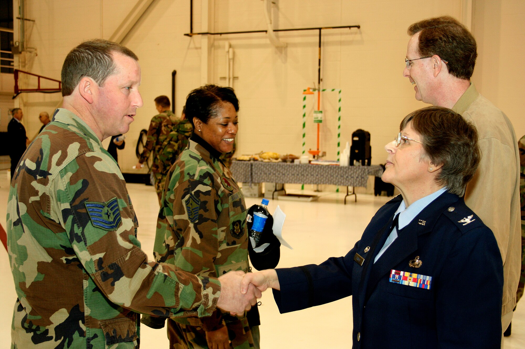 GRISSOM AIR RESERVE BASE, Ind., -- Col. Betty Bowen, 434th Support Group commander, is congratulated by Tech. Sgt. Richard VanPelt, 434th Logistics Readiness Squadron, on her assumption of command during the February unit training assembly.  She has the primary responsibility of formulating plans and establishing policies for a variety of areas including the infrastructure, services, logistics planning, personnel function, communications, contracting and security of Grissom. (U.S. Air Force photo/Tech. Sgt. Patrick Kuminecz)