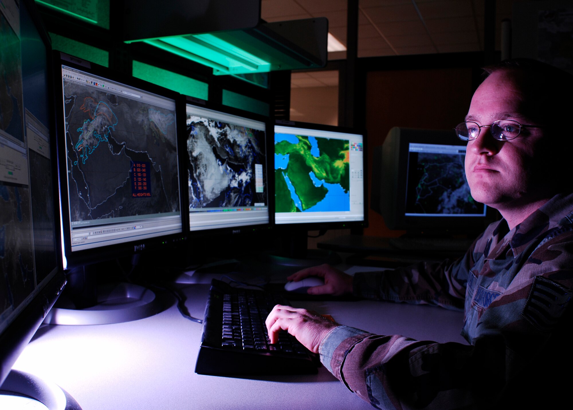 Tech. Sgt. Jason Miller, from Irving, Texas, analyzes cloud bases for Southwest Asia. Miller is a 16-year Air Force veteran and has spent the last four years at the Air Force Weather Agency at Offutt Air Force Base, Neb. The 35 year old is NCO in charge of the 2nd Weather Squadron's Southwest Asia Obscurant Forecast and Analysis Cell, a new program developed to provide regional specific data. (Photo by G. A. Volb)