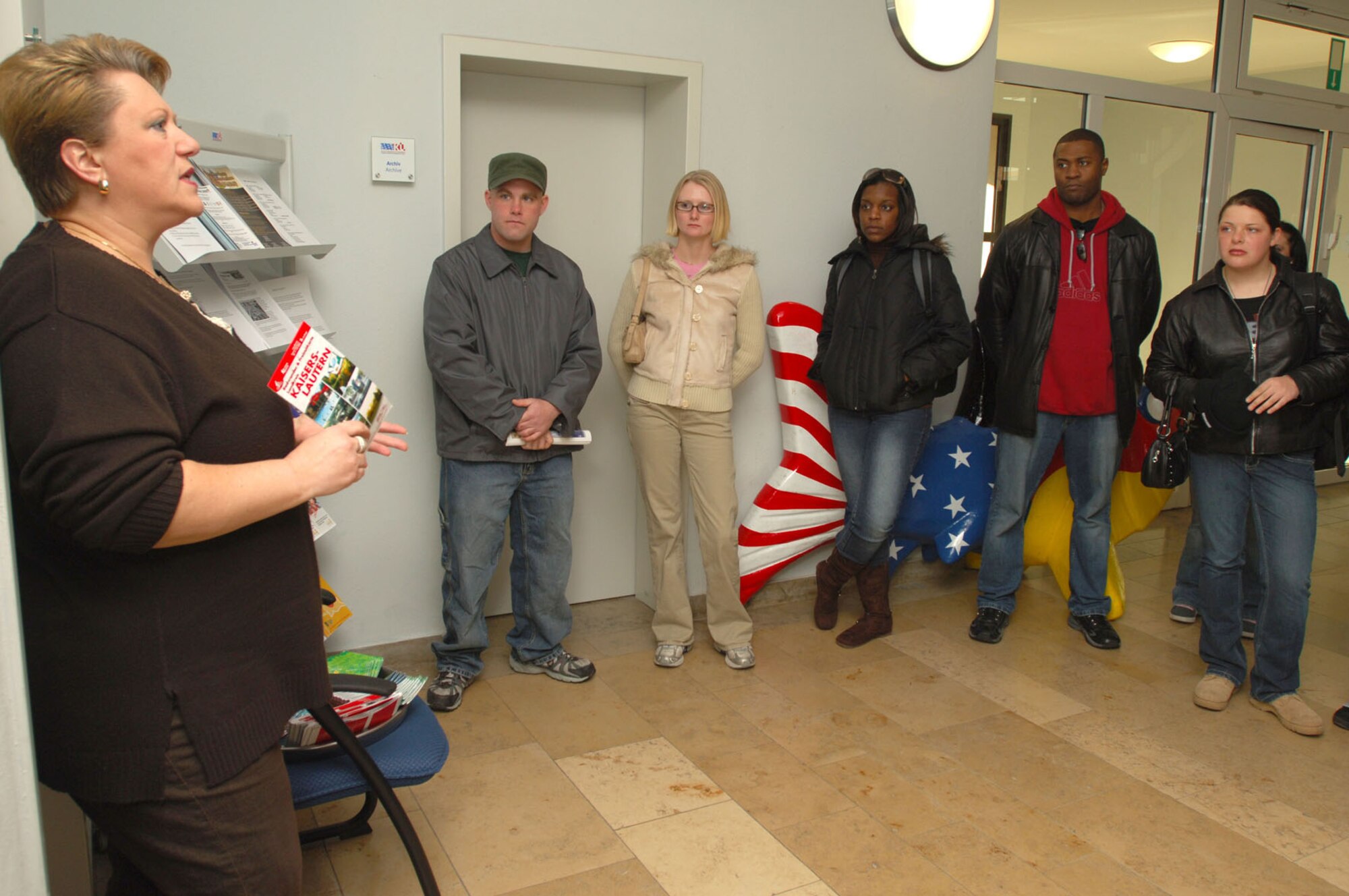 Sissi Koesling, host nation advisor of the German-American Community Office, briefs participants of a USO orientation tour Friday at their facility in Kaiserslautern. Photo by Senior Airman Melissa Sheffield