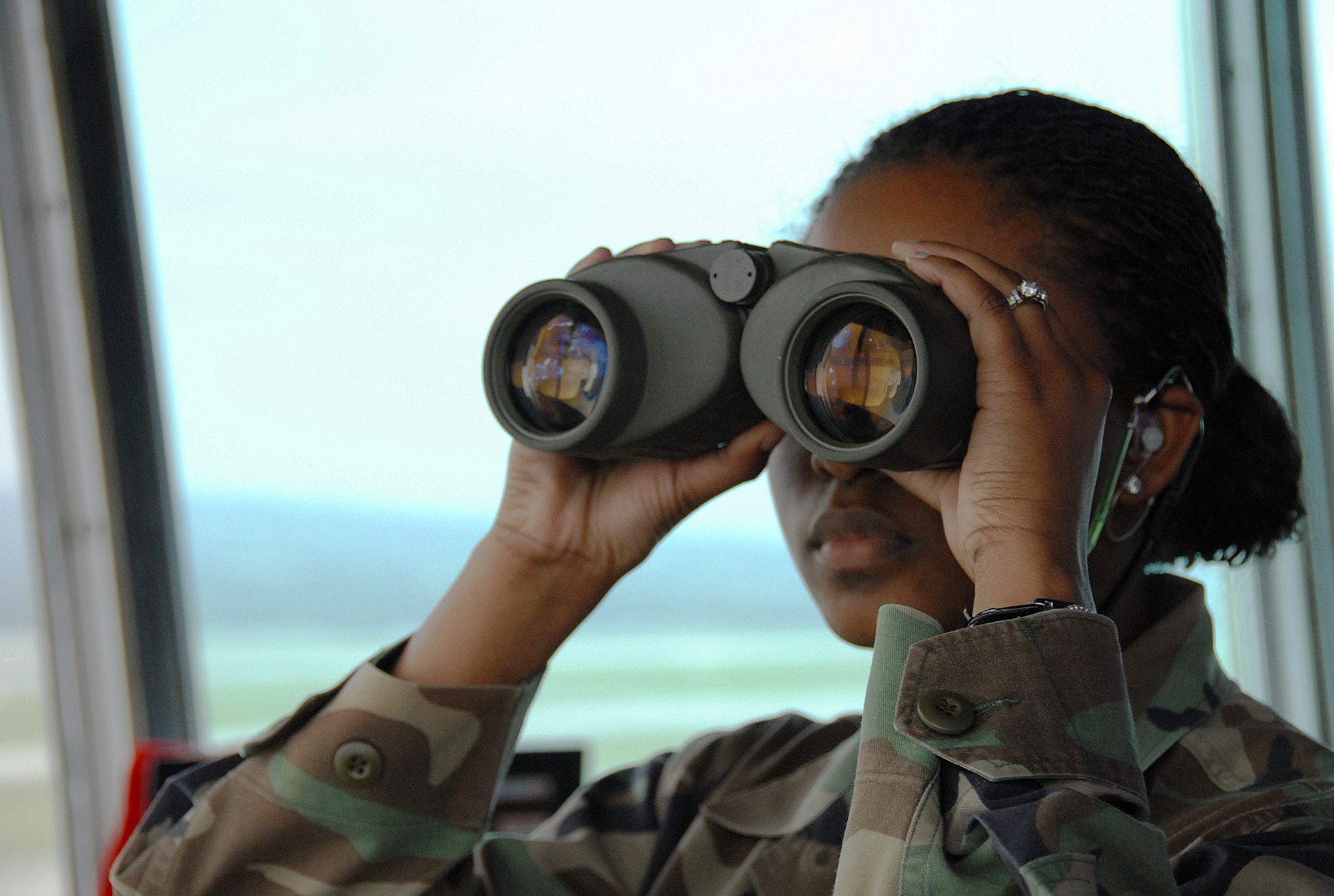 Senior Airman Laquetta Spann, 18th Operations Support Squadron, monitors an inbound aircraft during local operational readiness exercise Beverly High 08-4 at Kadena Air Base, Japan, Feb. 12, 2008. The 18th Wing conducted the exercise from Feb. 10 to 15 to test Airmen's ability to respond in contingency situations. (U.S. Air Force photo/Tech. Sgt. Anthony Iusi) 
