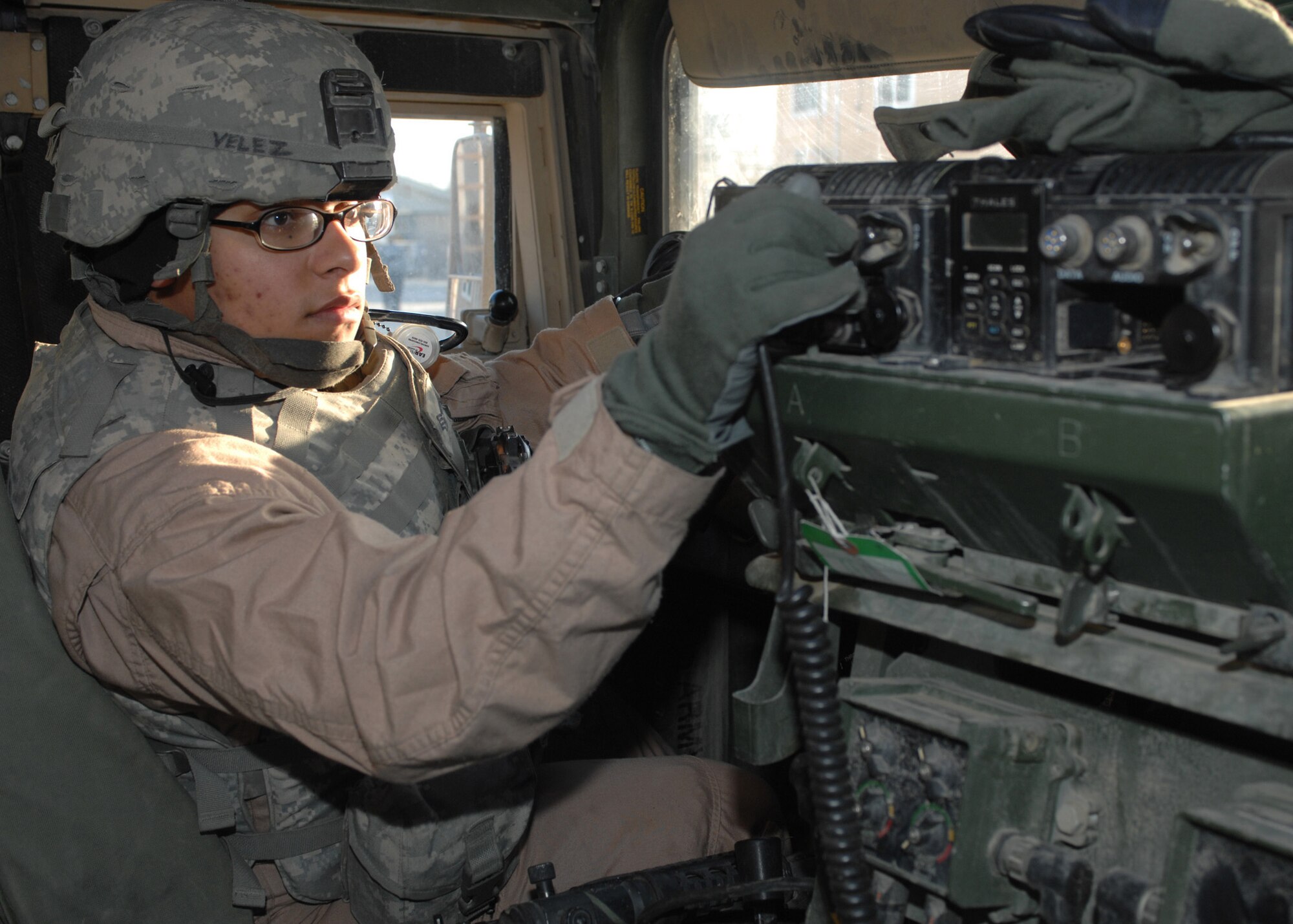 BAGRAM AIR BASE, Afghanistan - Senior Airman Vanessa Velez, a convoy driver with the Bagram Provincial Reconstruction Team, prepares her humvee just before her next mission outside the wire here Feb. 10. Velez, who is a vehicle maintenance controller with the 6th Logistics Readiness Squadron at MacDill Air Force Base, Fla., has driven at least 120 convoys during her 365-day deployment in Afghanistan. (U.S. Air Force photo by Master Sgt. Demetrius Lester) 