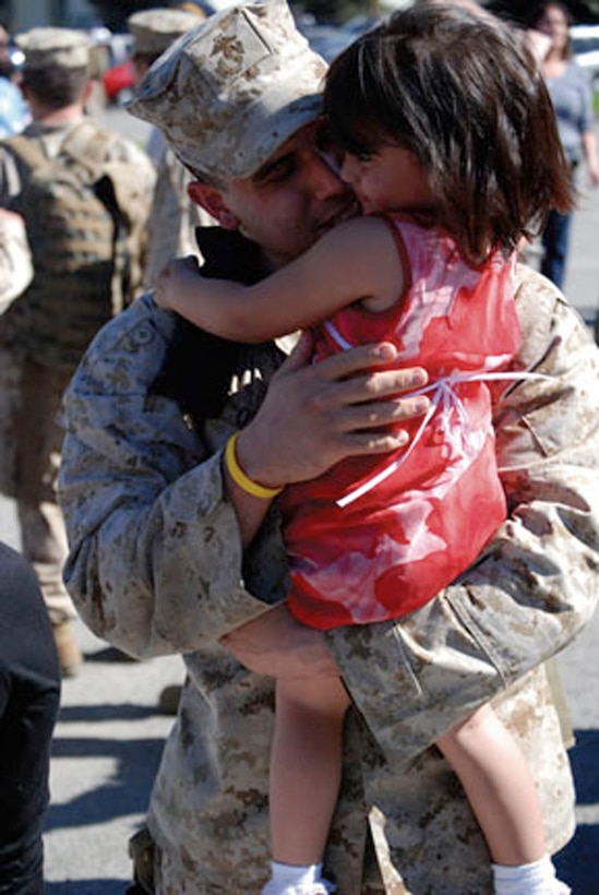 Cpl. Otero, a squad leader with B Company, 1st Battalion, 1st Marine Regiment, greets his daughter, Kylie, 3, upon his return from deployment Feb. 12.