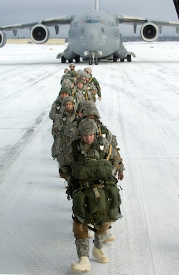 Airborne Soldiers from the 4th Quartermasters, Fort Richardson, Alaska, board a C-17 Globemaster III from the 517th Airlift Squadron before a training mission. The training mission included Soldiers parachuting into a drop zone and conducting air drops of training bundles that simulate the Soldier's equipment. (U.S. Air Force photo/Master Sgt. Keith Brown) 
