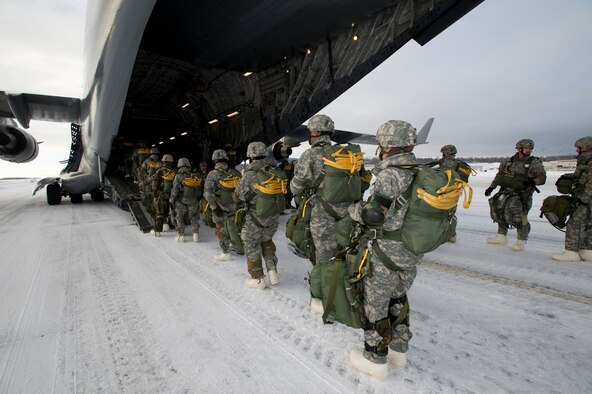 ELMENDORF AIR FORCE BASE, Alaska -- Air Force Tactical Air Control Party members and Airborne Soldiers from the 4th Quartermasters, Fort Richardson, Alaska, board a C-17 Globemaster III from the 517th Airlift Squadron before a training mission. The training mission included Soldiers parachuting into a drop zone and conducting air drops of training bundles that simulate the Soldier's equipment. (U.S. Air Force photo/Master Sgt. Keith Brown) 
