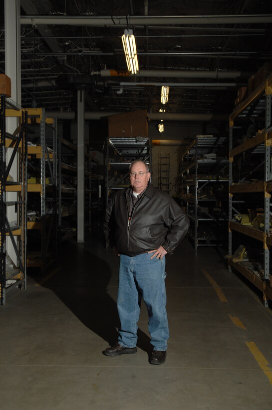 Al Weatherbee, 28th Maintenance Group technical service senior equipment propulsion specialist, stands amongst Ellsworth's collection of spare B-1 parts, most of which were previously located at several different bases, but are now a consolidated stockpile of equipment and parts commonly known as Al's Garage.  Al's Garage has saved the Air Force roughly 4 million dollars in assets by having all part in one location. (U.S. Air Force photo/ Senior Airman Anthony Sanchelli)

