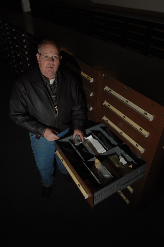 Al Weatherbee, 28th Maintenance Group technical service senior equipment propulsion specialist, rummages through Ellsworth's collection of B-1 parts, most of which were previously located at several different bases, but are now a consolidated stockpile of equipment and parts commonly known as Al's Garage.  Al's Garage has saved the Air Force roughly 4 million dollars in assets by having all part in one location. (U.S. Air Force photo/ Senior Airman Anthony Sanchelli)
