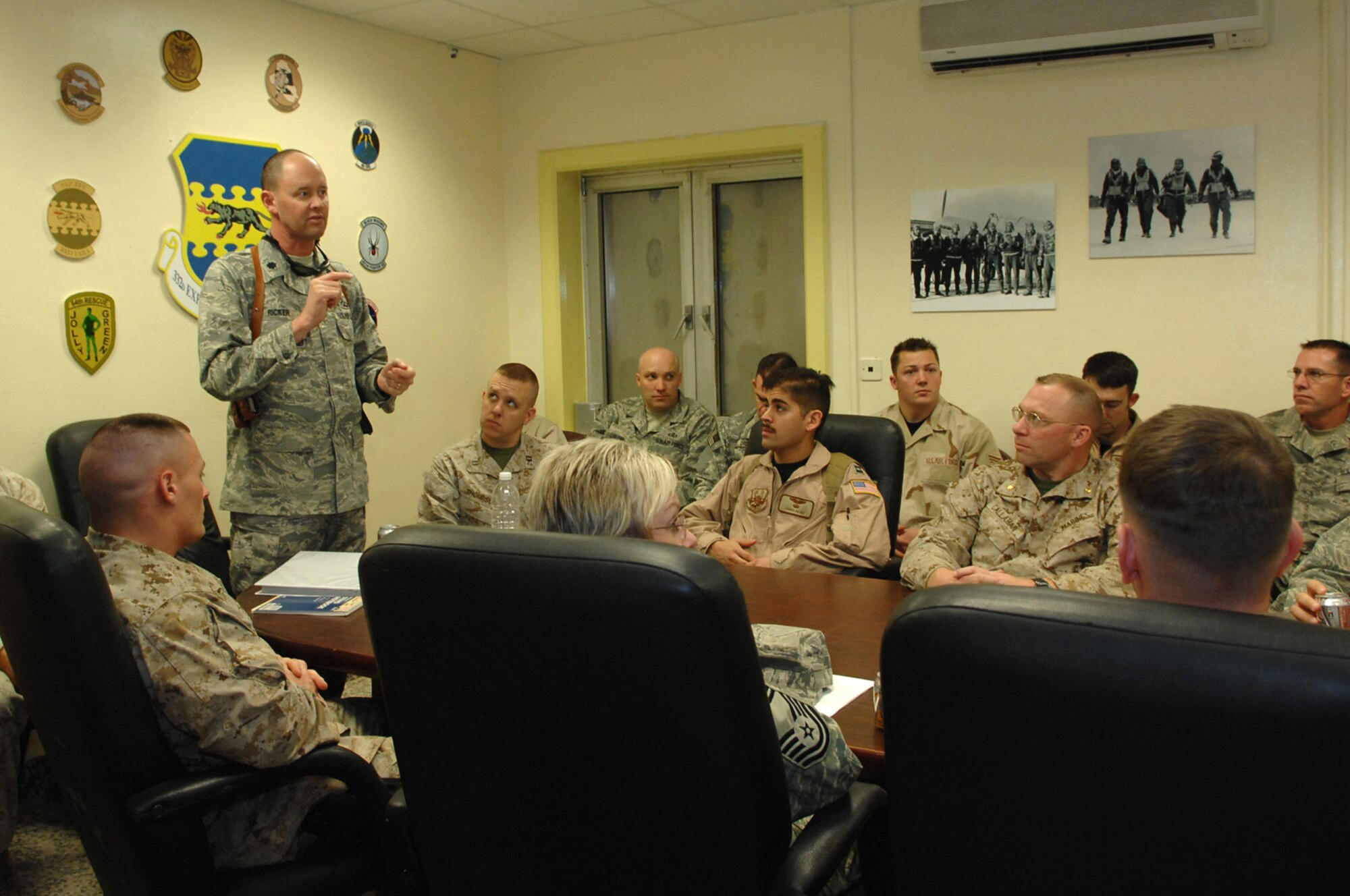 Lt. Col. Robert Ricker, discusses joint air traffic control and central Iraq airspace utilization issues with subject matter experts from the 3rd Marine Air Wing-Forward here, Feb. 10. Colonel Ricker is the 332nd Expeditionary Operations Support Squadron airfield operations flight commander. (U.S. Air Force photo/Senior Airman Julianne Showalter)