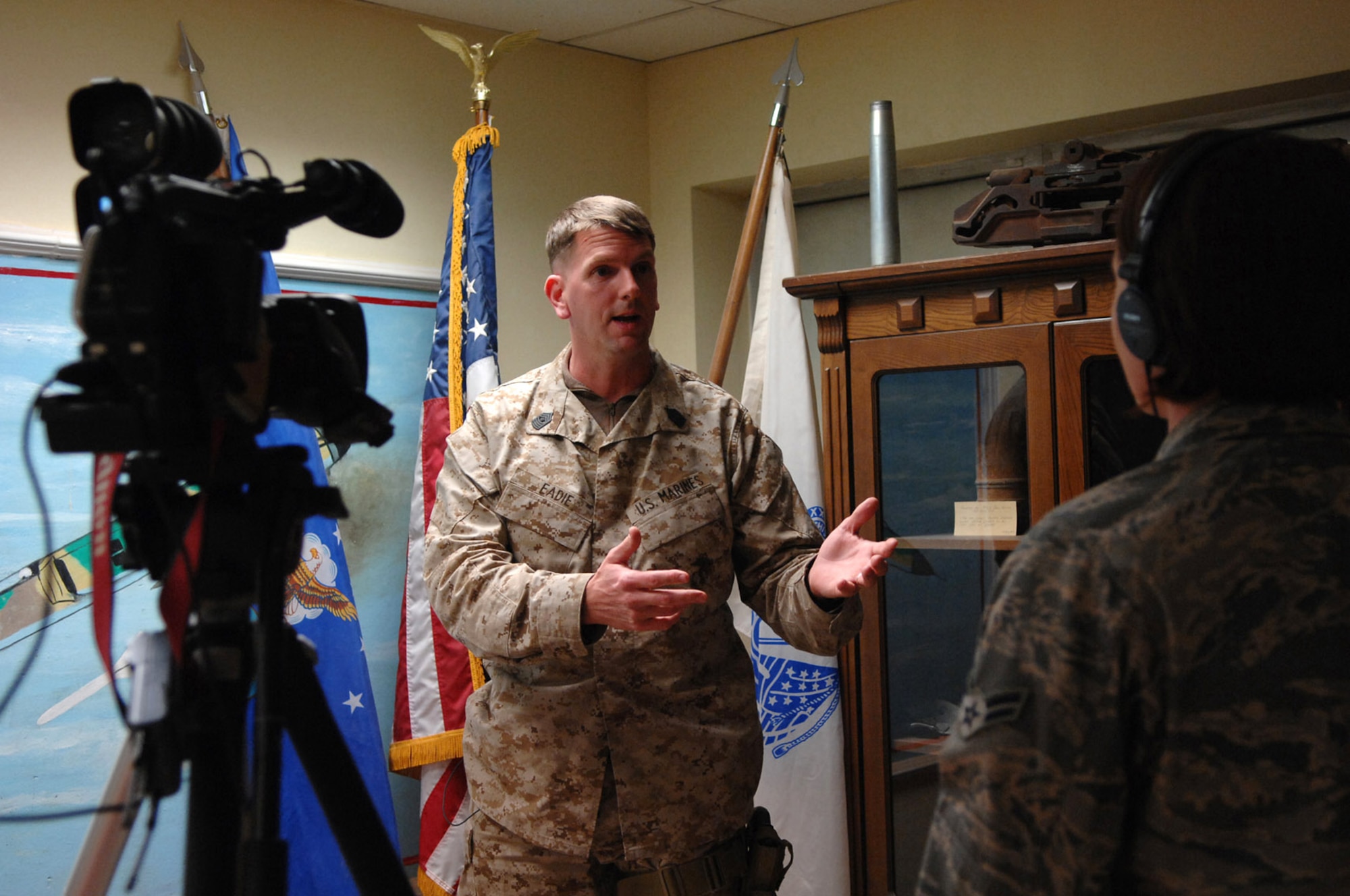 Airman 1st Class April Mullens interviews Master Gunnery Sgt. Mark Eadie about the importance of increasing the integration and synchronization of military airpower as well as civil air traffic between Air Force and Marine assets here, Feb. 10. Airman Mullens, is a videographer with the 332nd Air Expeditionary Wing Public Affairs Office. Sergeant Eadie is the Marine Air Control Squadron 1, Tactical Air Operations Center chief, (U.S. Air Force photo/Senior Airman Julianne Showalter)