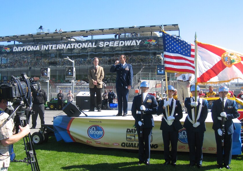 Capt. Edward Torres, 919th Logistics Readiness Squadron, sings the National Anthem at the Daytona International Speedway during the Daytona 500 Qualifying. Captain Torres was selected from numerous entries to sing at the Feb. 10 event. (U.S. Air Force Photo/Master Sgt. Erika Bueno)